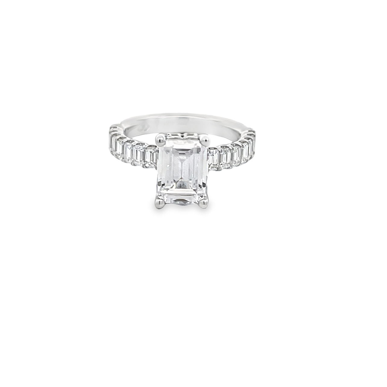 This refined 14k white gold semi-mount features emerald cut side diamonds, offering a sleek and sophisticated look. The step-cut facets of the side stones enhance the brilliance of your chosen center stone, giving this classic beauty a modern edge. (Center stone not included)-14k White gold-Emerald cut diamonds, 1.33cts-Size 6.5, Contact for sizing optionsItem# 140-00209 Emerald Cut Mounting