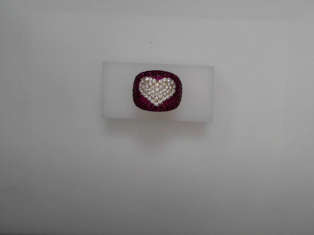 Radiating charm and romance, this ring features sparkling diamonds arranged in a heart shape, framed by vivid red rubies. A bold expression of love, it’s the perfect piece to celebrate life’s most heartfelt moments.-14k Yellow gold-Round diamonds, 0.94cts-Round rubies, 2.33cts-Size 6Item# 804-00784 Ruby Heart Ring