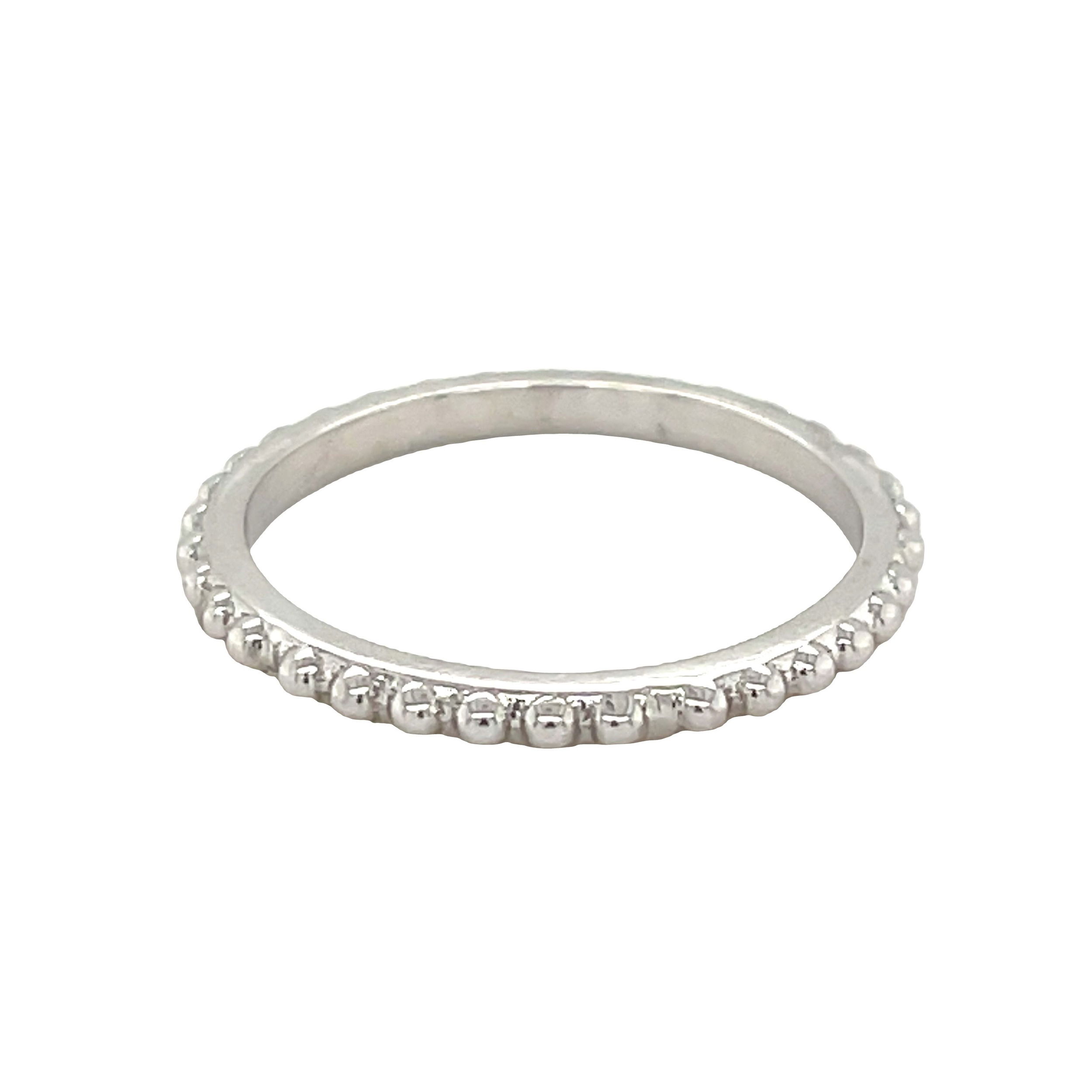 This 18k white gold wedding band features a granulated texture for a distinct, artisanal look. Its intricate design adds a touch of character and elegance to any style.-18k White gold-Size 6.25 Contact for sizing optionsItem# 110-00595 Beaded Wedding Band