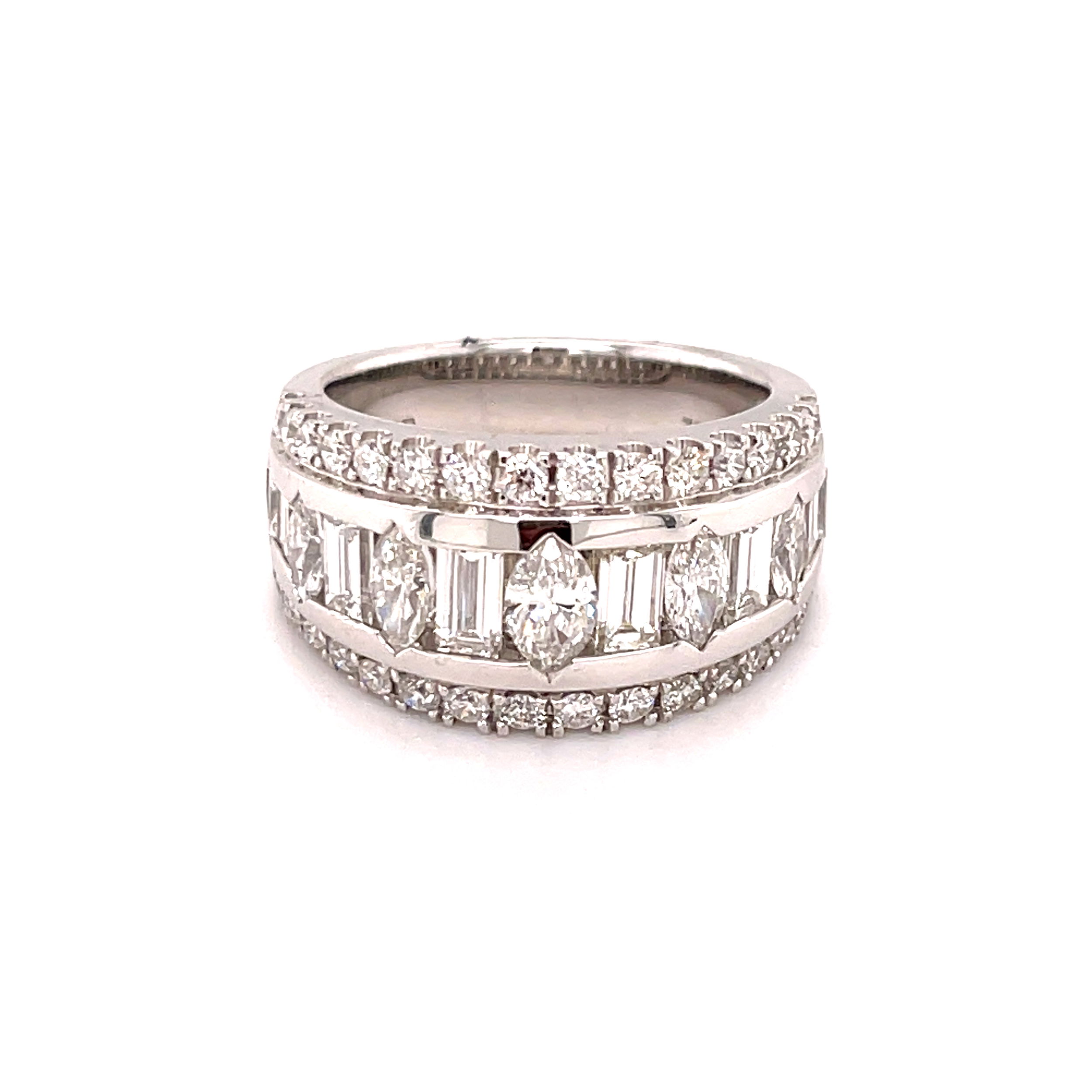 Celebrate your milestone with this stunning 18k White gold anniversary band, featuring alternating marquise and baguette diamonds elegantly set between two rows of shimmering round diamonds. The unique combination of shapes creates a striking yet timeless design, making it the perfect symbol of your enduring love.-18k White gold-Marquise, Baguette, Round diamonds, 2.51cts-Size 6.5, Contact for sizing optionsItems# 130-01025 Diamond Anniversary Band