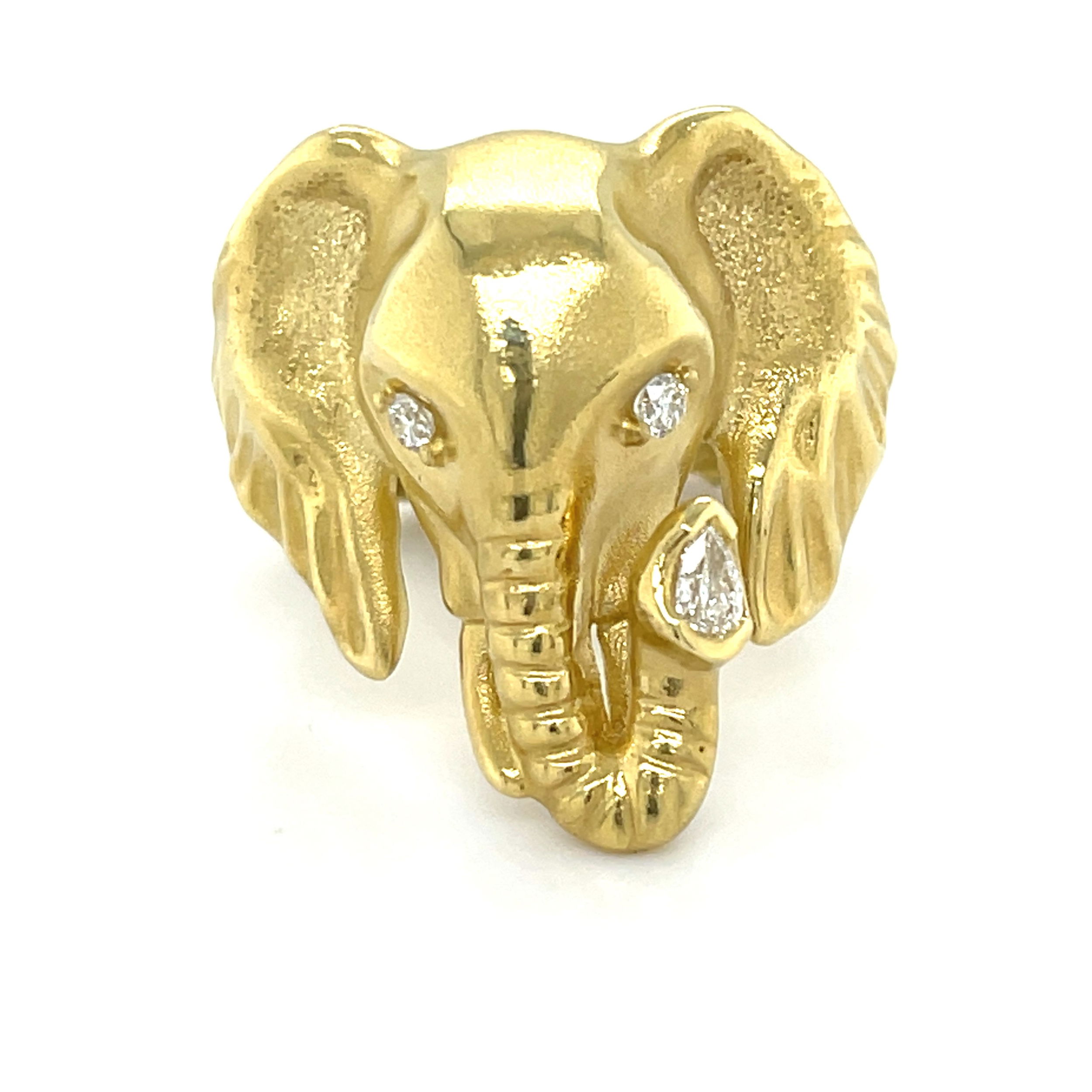 This elephant head ring in 18k yellow gold showcases multi-shaped diamonds for a striking, radiant look. Nature-inspired motifs are on trend, making this piece a stylish choice for adding a unique touch to your collection.-18k Yellow gold-Round and Pear diamonds, 0.16cts-Item# 804-00806 Babar Ring