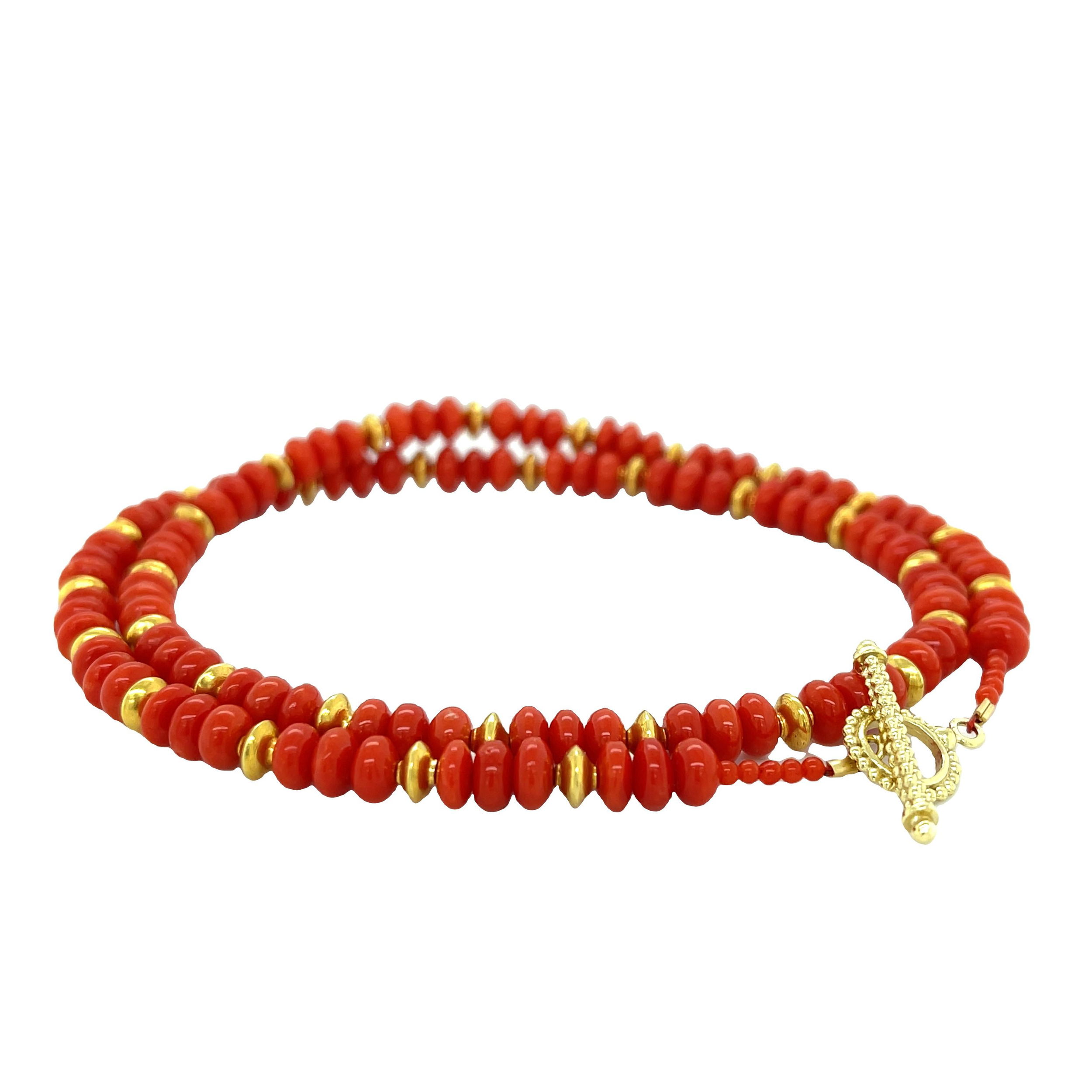 This coral wrap bracelet stuns with its gold discs, and effortlessly transforms into a long or layered necklace. Ideal for dressing up a casual outfit or enhancing evening wear. Pair with a Keepsake Finial Pendant for added styling options.-18k Yellow gold-Coral rondelles and gold discs-Length 17.5"Item# 808-00823 Coral with Gold Discs Wrap Bracelet 17.5"