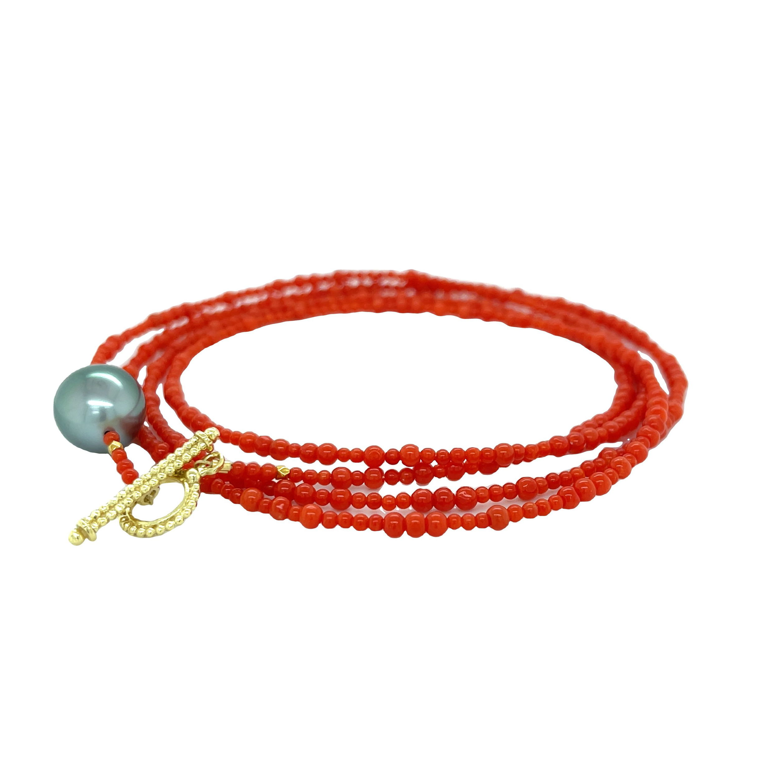 The 18k yellow gold wrap bracelet with a beautiful Tahitian pearl is ideal for any occasion. It effortlessly transitions into a long or layered necklace for versatility. Paired perfectly with a Finial Keepsake Pendant.-18k Yellow gold-Trilliant Tahitian pearl -Length 36”Item# 808-00826 Coral and Tahitian Pearl Convertible Wrap Bracelet 36"