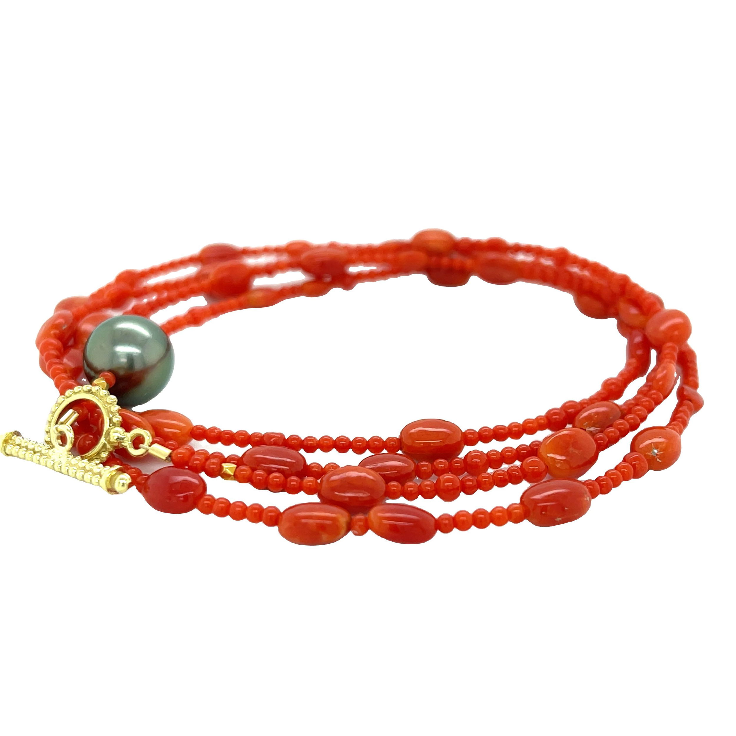 This wrap bracelet combines 18k yellow gold with an exquisite Tahitian pearl, creating a stunning piece that wraps elegantly around your wrist. This piece can also be worn as a long or layered necklace for a versatile and stylish touch. Pair with an Empress Pendant for added styling options.-18k Yellow gold-Tahitian pearl-Length 32”Item# 808-00874 Coral and Tahitian Pearl Convertible Wrap Bracelet 32"