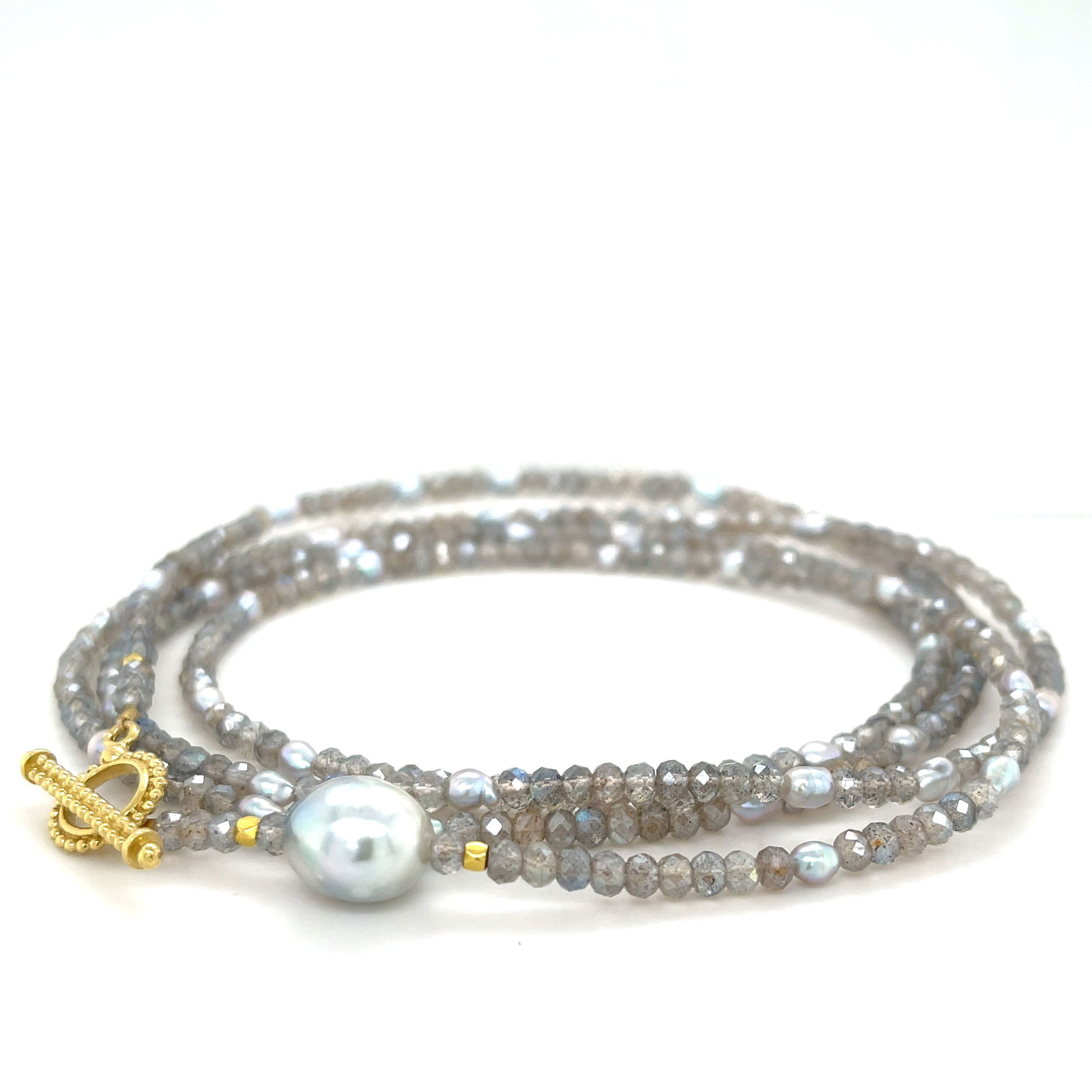 This labradorite bead wrap bracelet features 18k yellow gold and a stunning cultured pearl, creating a stylish and sophisticated look. Perfect for any occasion, it's also able to transform into a long or layered necklace. Pair with an Empress Pendant for added styling options.-18k Yellow gold-Labradorite beads-Cultured pearl-Length 36”Item# 808-00715 Labradorite Bead and Akoya Pearl Convertible Wrap Bracelet 36"