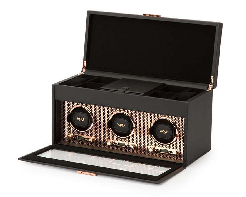 Wolf's Axis triple watch winder with storage comes in a sleek black and copper design, perfect to show of three of your best timepieces, keeping them perfectly wound and charged. A perfect gift for the watch enthusiast, this piece offers a good amount of storage for papers, boxes, links, etc.-Leather-Copper-Item# 001-799-01243 Triple Watch Winder