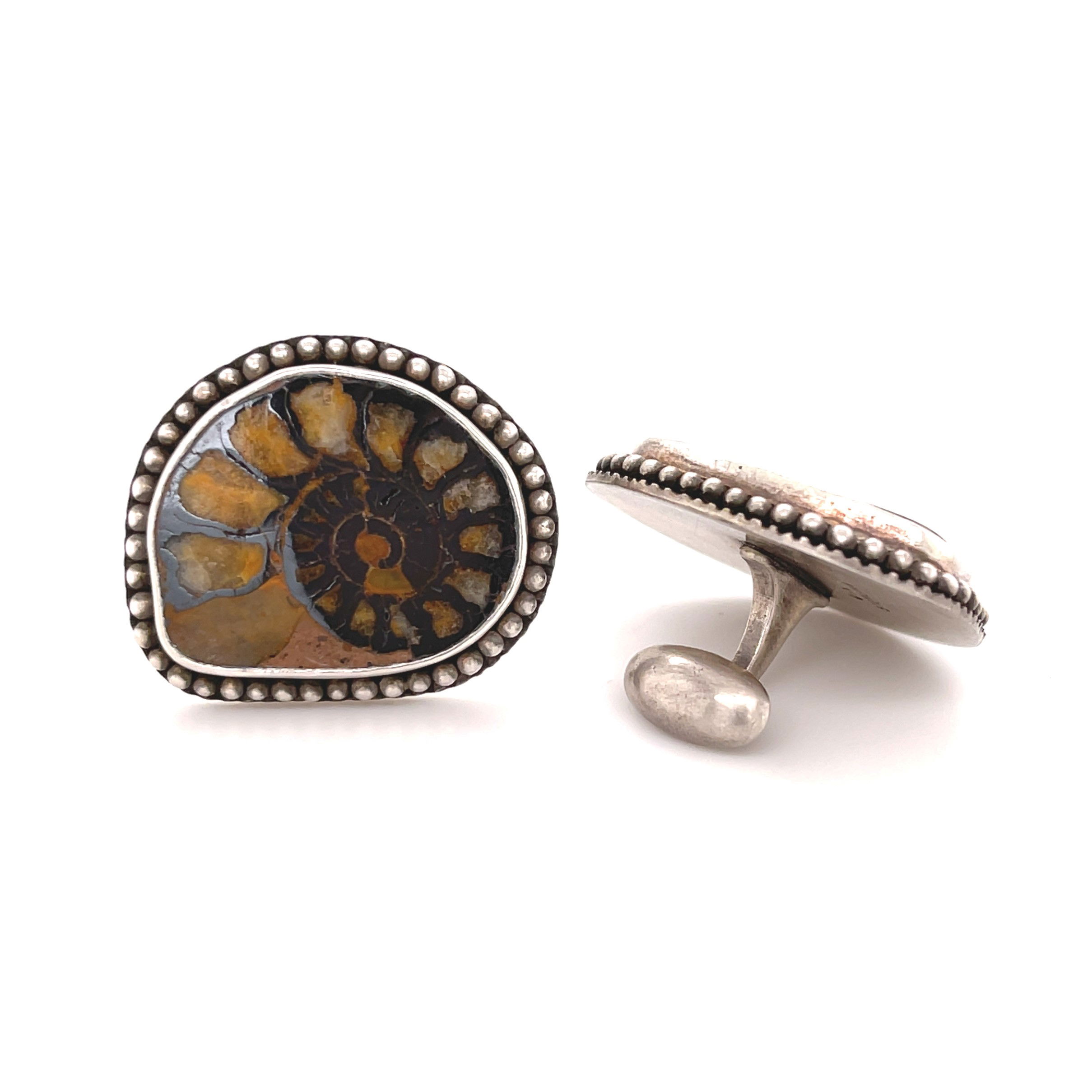 These sterling silver cufflinks features nautilus shells, adding a touch of nature’s beauty to your style.-Sterling silver-Nautilus shellItem# 800-00243 Nautilus Shell Cufflinks