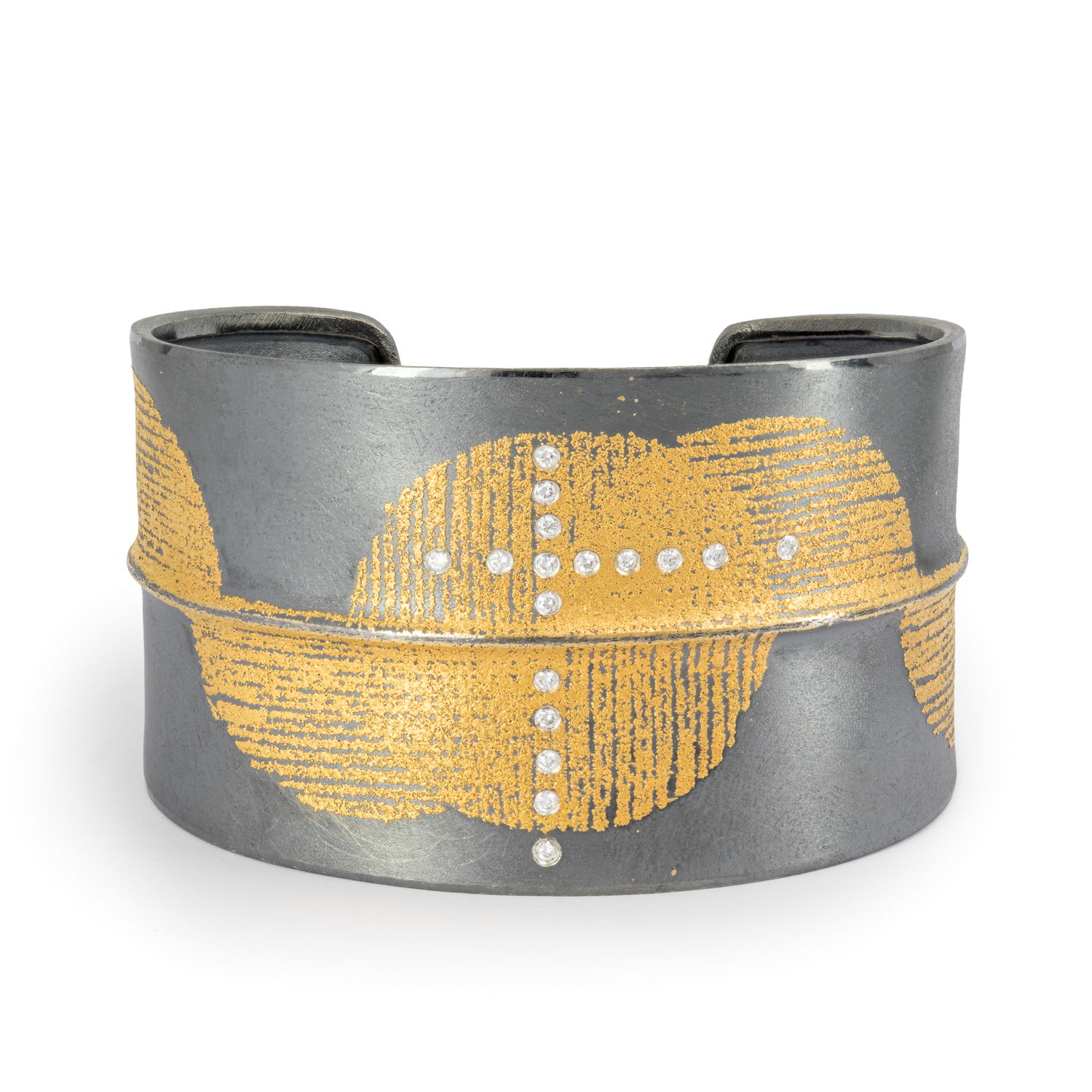 With inspiration rooted in natural structures and growth patterns, Peter Schmid finds his muse within nature and urban environments themselves. Showcasing a unique approach to jewelry design, the world of Atelier Zobel boasts creativity and inspiration within every piece.-24k Yellow gold-Sterling silver-Round diamonds, 0.17ctsItem# 808-00604 Circles Cuff