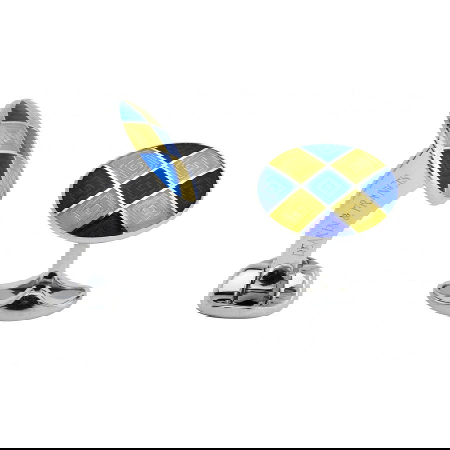 These Deakin & Francis men’s accessories are crafted from sterling silver and finished with vibrant yellow and blue checker enamel for a bold, playful touch. Expertly handcrafted in England, they combine traditional quality with contemporary flair.-Sterling silver-EnamelItem#001-800-00343 Yellow and Blue Checker Enamel Cufflinks