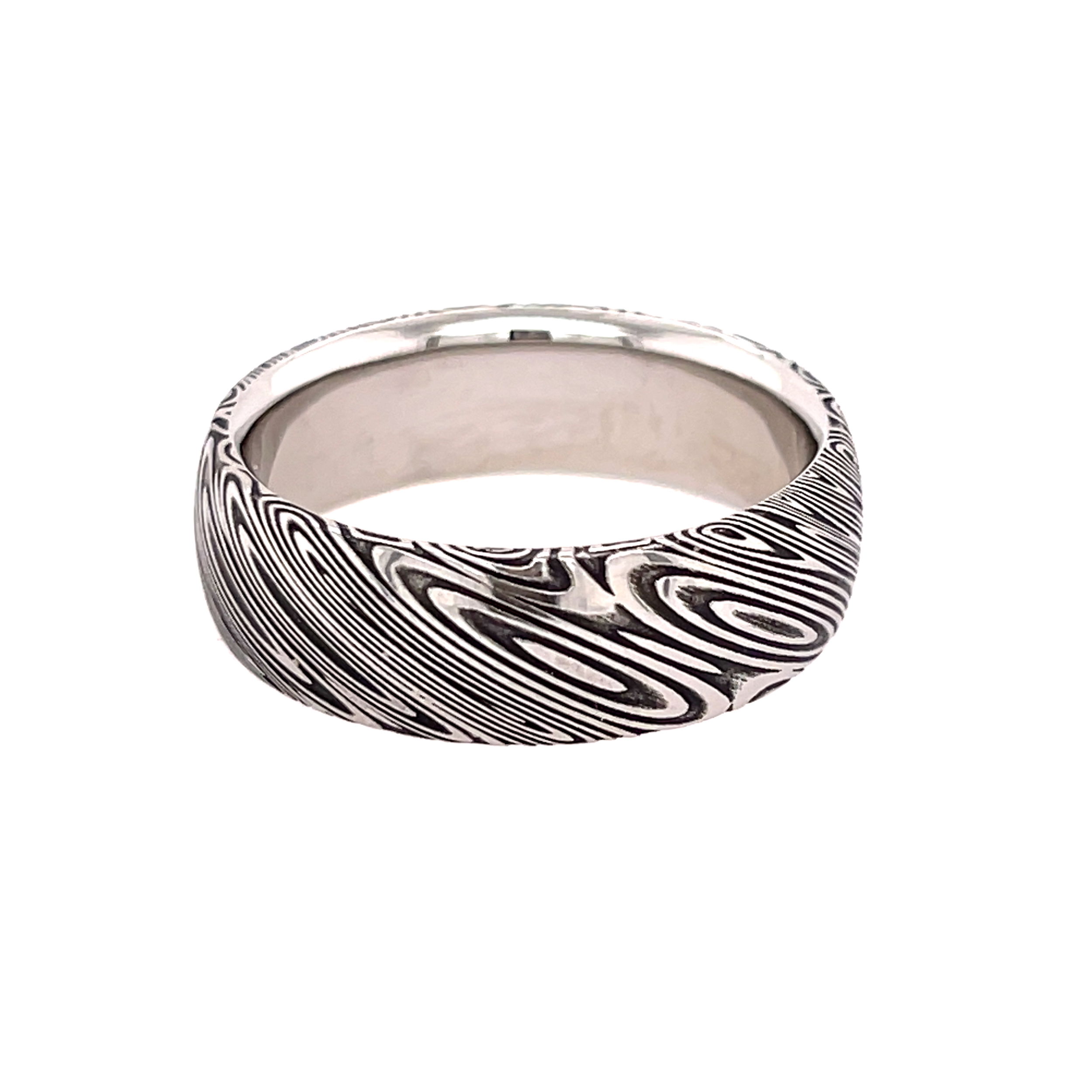 Crafted from Damascus steel, this band features a striking wood grain pattern that blends organic texture with enduring strength. A unique symbol of character and craftsmanship.-Damascus-7mm-Size 10.5, Contact for sizing optionsItem# 405-00005 Wood Grain Men's Band