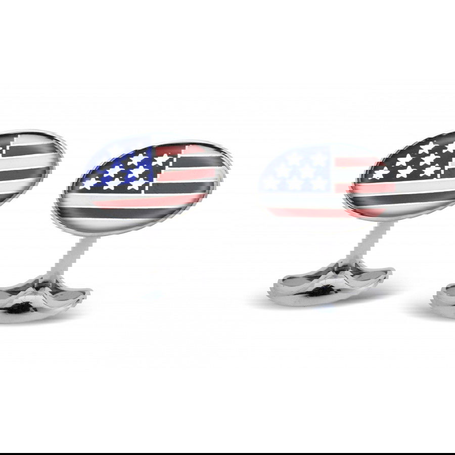 These Deakin & Francis USA cufflinks are expertly crafted in sterling silver and feature vibrant enamel detailing for a striking, patriotic statement. Combining traditional craftsmanship with bold design, they offer a distinguished accessory for the modern gentleman.-Sterling silver-Enamel-Item# 800-00348 Oval U.S.A. Flag Cufflinks
