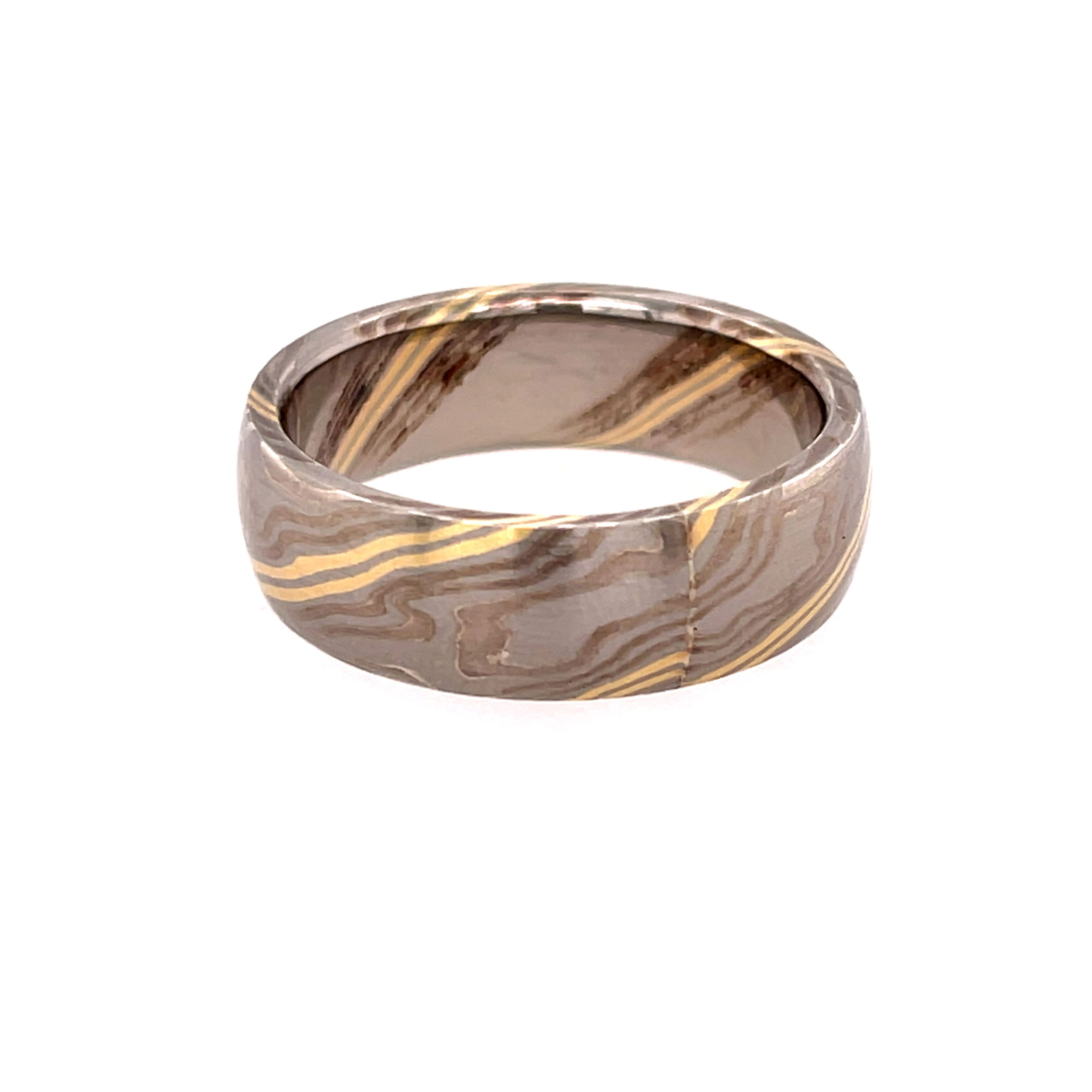 This domed band in 18k yellow gold and palladium features an elegant Mokume Gane River Pattern, flowing seamlessly around the ring in rich, layered tones. A perfect blend of artistry and tradition, it offers a unique, organic look for those who appreciate exceptional craftsmanship.-18k Yellow gold and Palladium-7mm-Size 10.5, Contact for sizing optionsItem# 405-00053 Mokume Gane River Band