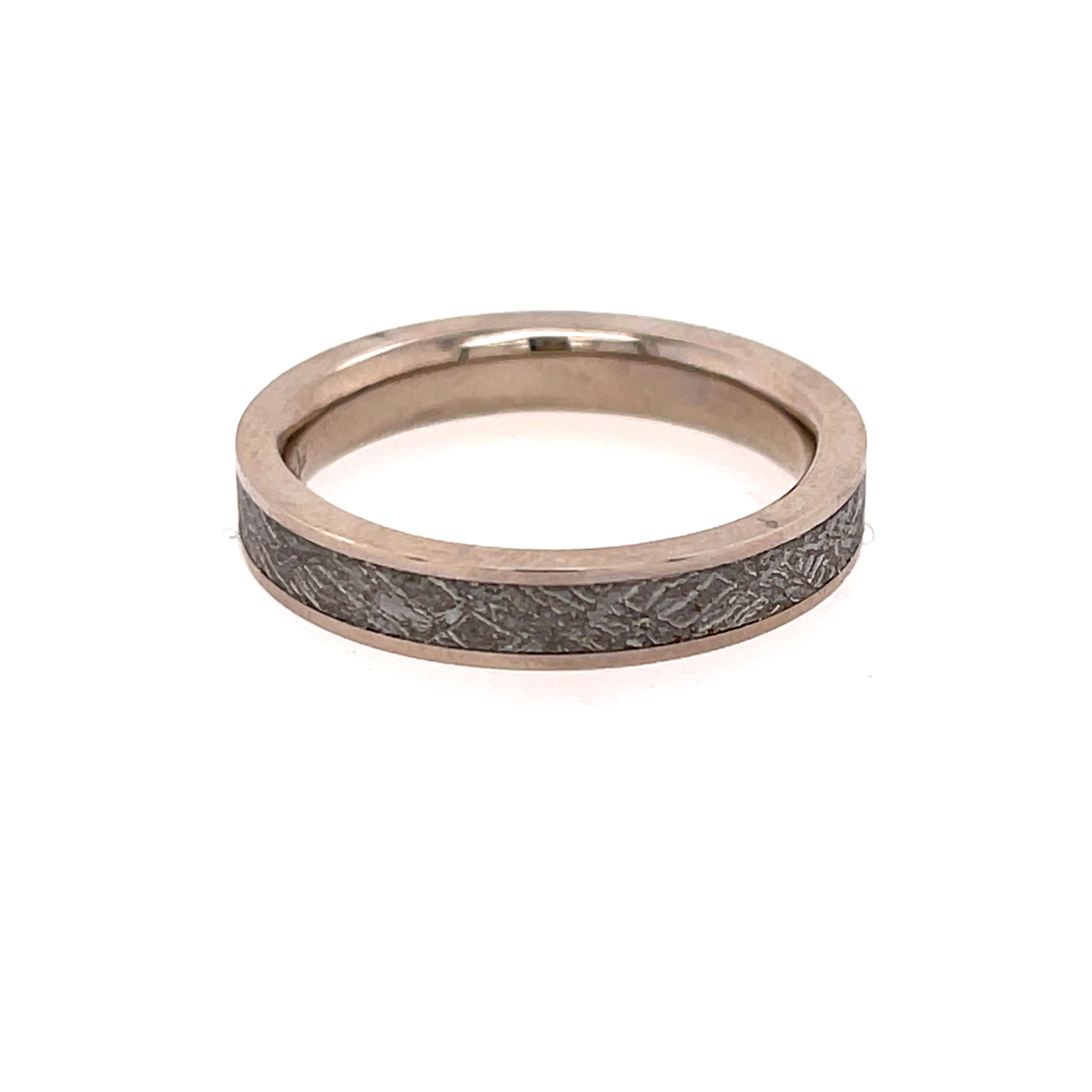 This palladium men's band features an authentic Sirius Gibeon Meteorite inlay at its center, showcasing the natural crystalline pattern formed over billions of years. Set in a refined metal band, this ring blends cosmic history with timeless craftsmanship—perfect for the man drawn to something rare and extraordinary.-Palladium-Sirius Gibeon Meteorite-4mmSize 9, Contact for sizing optionsItem# 405-00004 Sirius Gibeon Meteorite Band