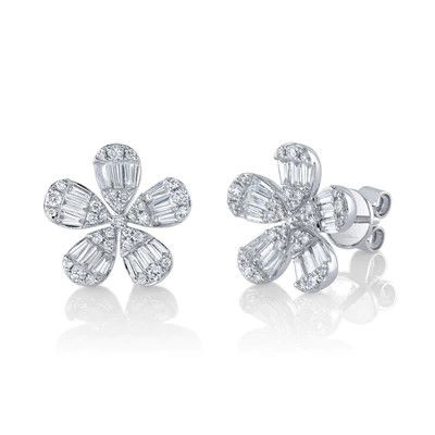 Floral inspired studs in white gold with diamonds. All Shy Creation diamonds are natural and hand-selected. All stones are unique and hand set. As a result, you can expect slight variations in the shade, hue, tint of the color stones and stone count.-14k White gold-Round diamonds, 0.32cts-Baguette diamonds, 0.68ctsItem# 805-2000187 Diamond Baguette Flower Stud Earrings