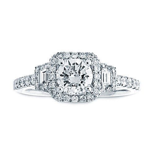 This elegant 14k White gold three-stone halo engagement ring features a stunning center diamond surrounded by a sparkling halo, with sleek baguette side diamonds enhancing its beauty. The three-stone design symbolizes your past, present, and future, while the baguette diamonds add a touch of sophistication and modern flair. (Center diamond sold separately.)-14k White gold-Round diamonds, 0.34cts-Baguette diamonds, 0.16cts-Size 6.5, Contact for sizing optionsItem# 100-00162 Florence