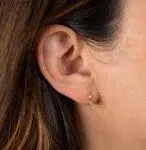 Combining classic elegance with on trend shapes and styles, JFJ offers something for women of all ages. From the Lisse Collection, these hoops feature round, and baguette cut white diamonds set in an alternating pattern on an 18K yellow gold body.-18k Yellow gold-Round & Baguette white diamonds, 0.32cts-Dimensions, 6mm x 2mmItem# 805-2000197 Diana Hoop Huggie Earrings With Diamonds