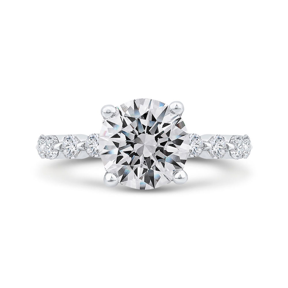 This stunning 14k White gold semi-mount features round diamonds in shared prongs, creating a seamless row of brilliance along the band. A hidden halo beneath the center stone adds an extra touch of sparkle, visible from every angle. Elegant and timeless, this setting is designed to enhance your diamond beautifully. (Center stone not included)-14k White gold-Round diamonds, 0.99cts-Size 6.5, Contact for sizing detailsItem# 140-00197 Hidden Halo Mounting