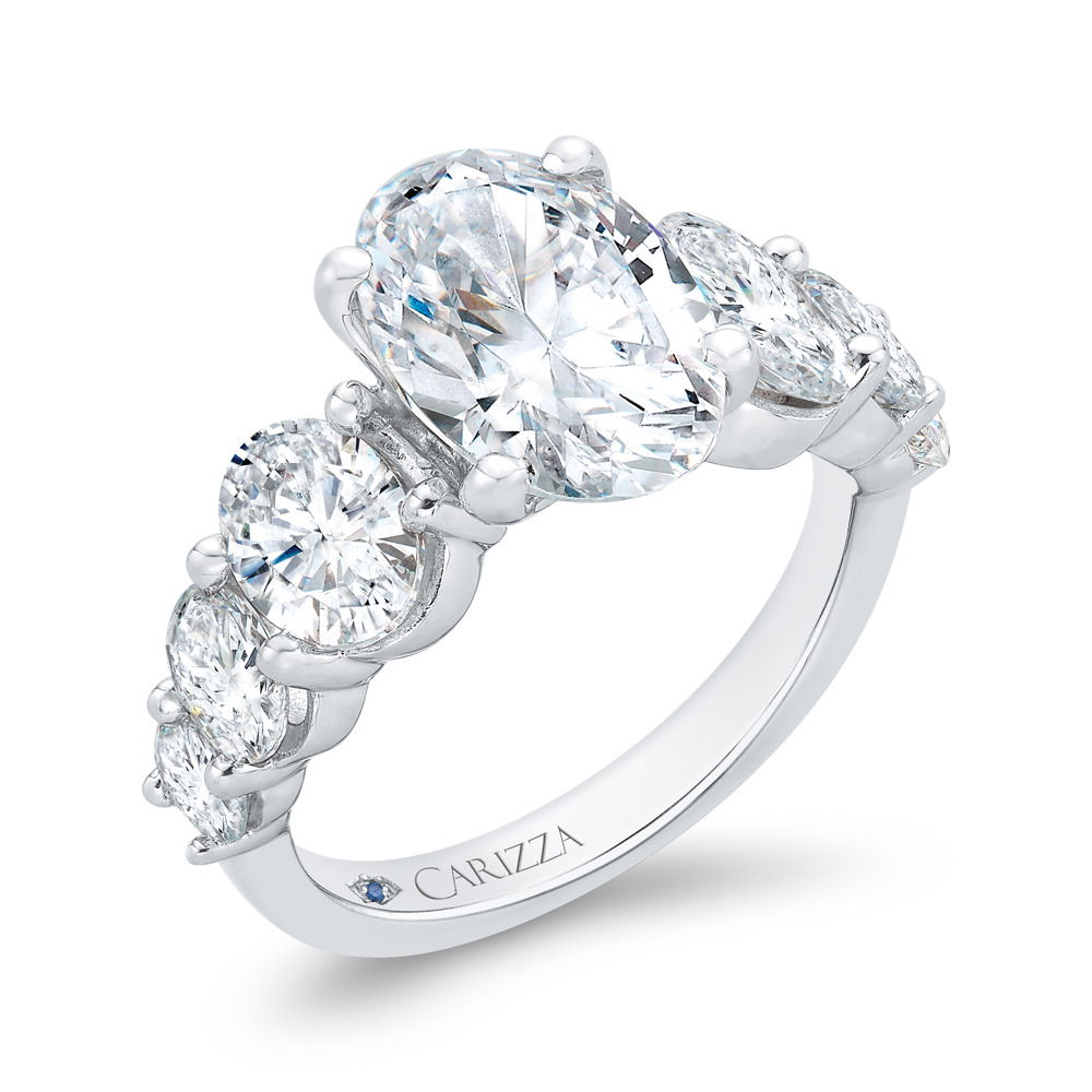 This stunning 14k White gold semi-mount features large graduating oval side diamonds, creating a bold and elegant look. The carefully arranged side stones enhance the brilliance of the center stone, adding depth and sophistication. (Center stone not included)-14k White gold-Oval diamonds, 2.10cts-Size 6.5, Contact for sizing optionsItem# 140-00195 Graduating Oval Mounting