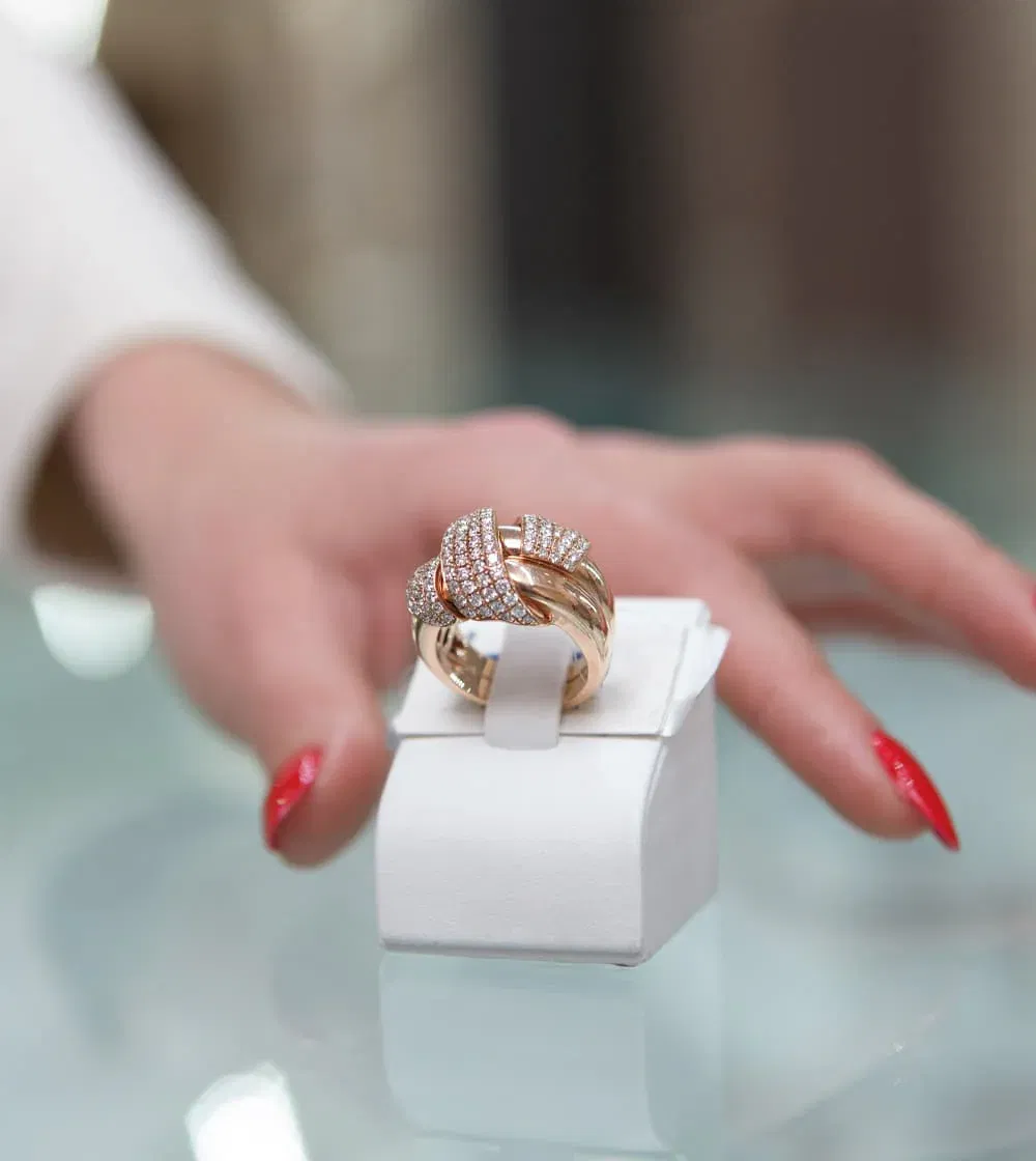Close-up of diamond rings held in a white display box at Naifeh Fine Jewelry