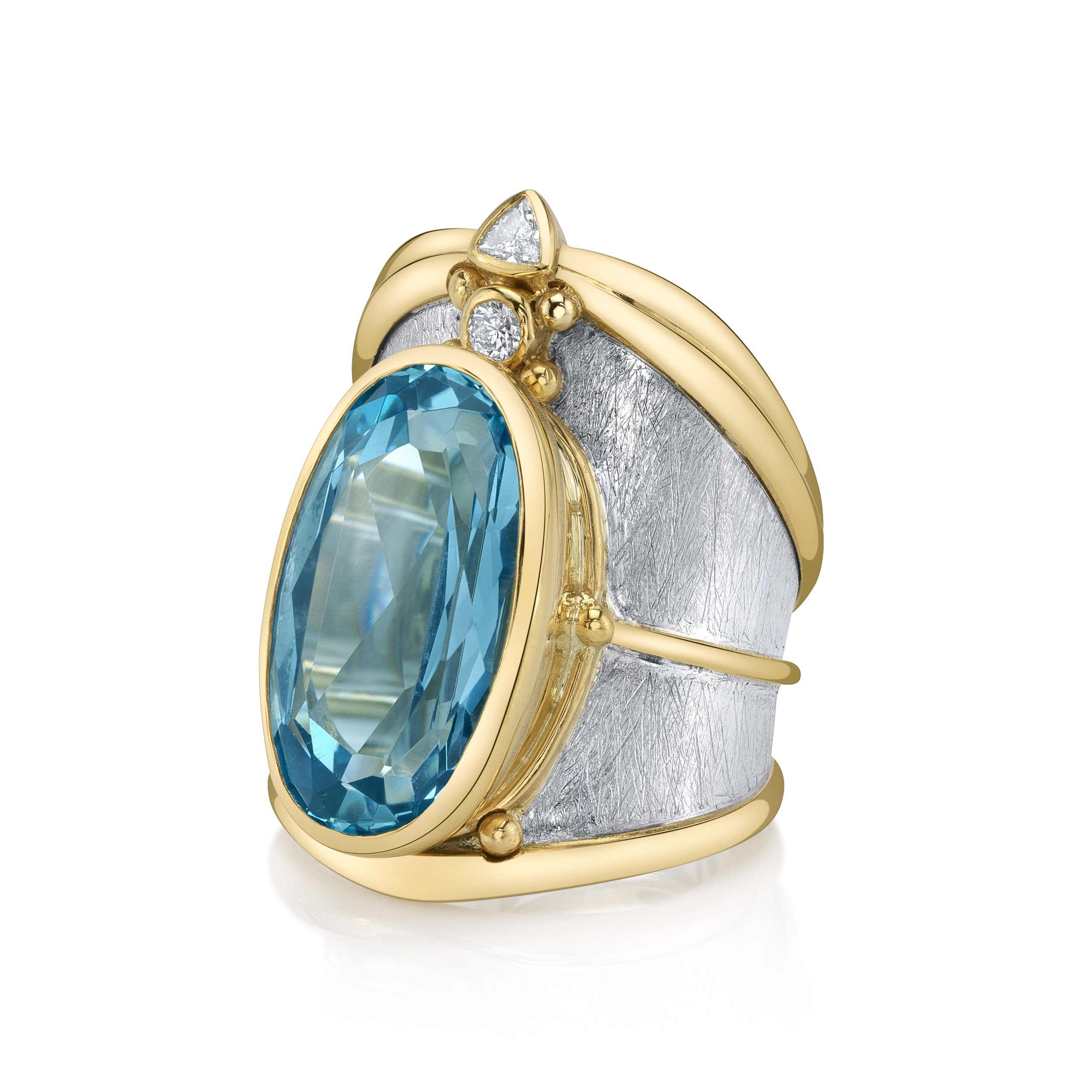 The Adessa Ring, with its oval aquamarine centerpiece and crown of diamond accents, blends 22k yellow gold and sterling silver. This standout piece is perfect for making an elegant statement to any event.-22k yellow gold-Sterling silver-Oval aquamarine, 11.45ct-Trillian diamond, 0.10ct-Round diamond, 0.08ct-Size 7. Contact for sizing options.Item# 200-01088 Adessa Ring