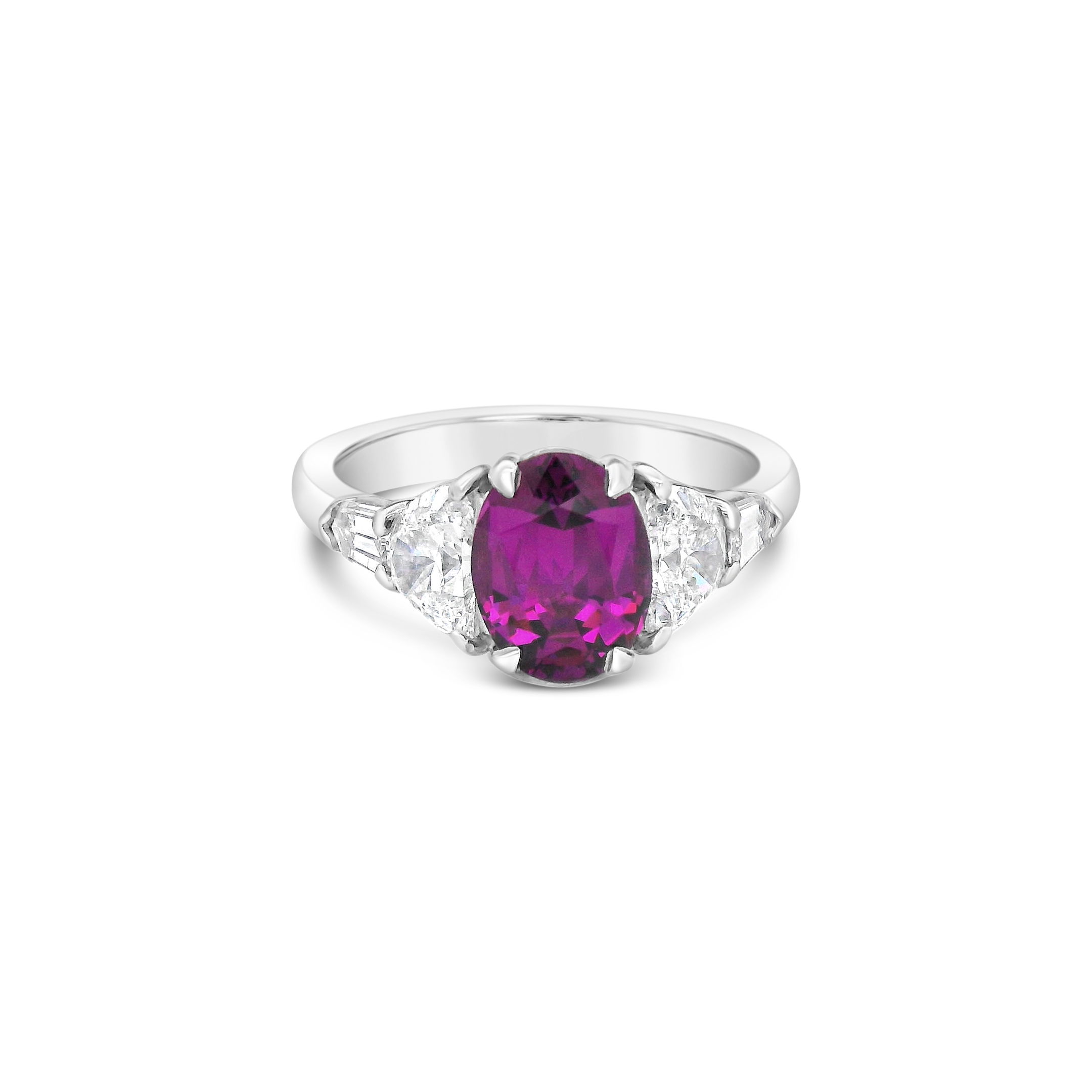 This platinum ring centers an oval garnet that brings a bold pop of purple, framed by shimmering diamonds for added brilliance. It's a striking balance of strength and beauty—perfect for a statement moment.-Platinum-Oval garnet, 1.85ct-Diamonds, 1.15ctsItem# 001-200-01140 Purple Oval Garnet Ring