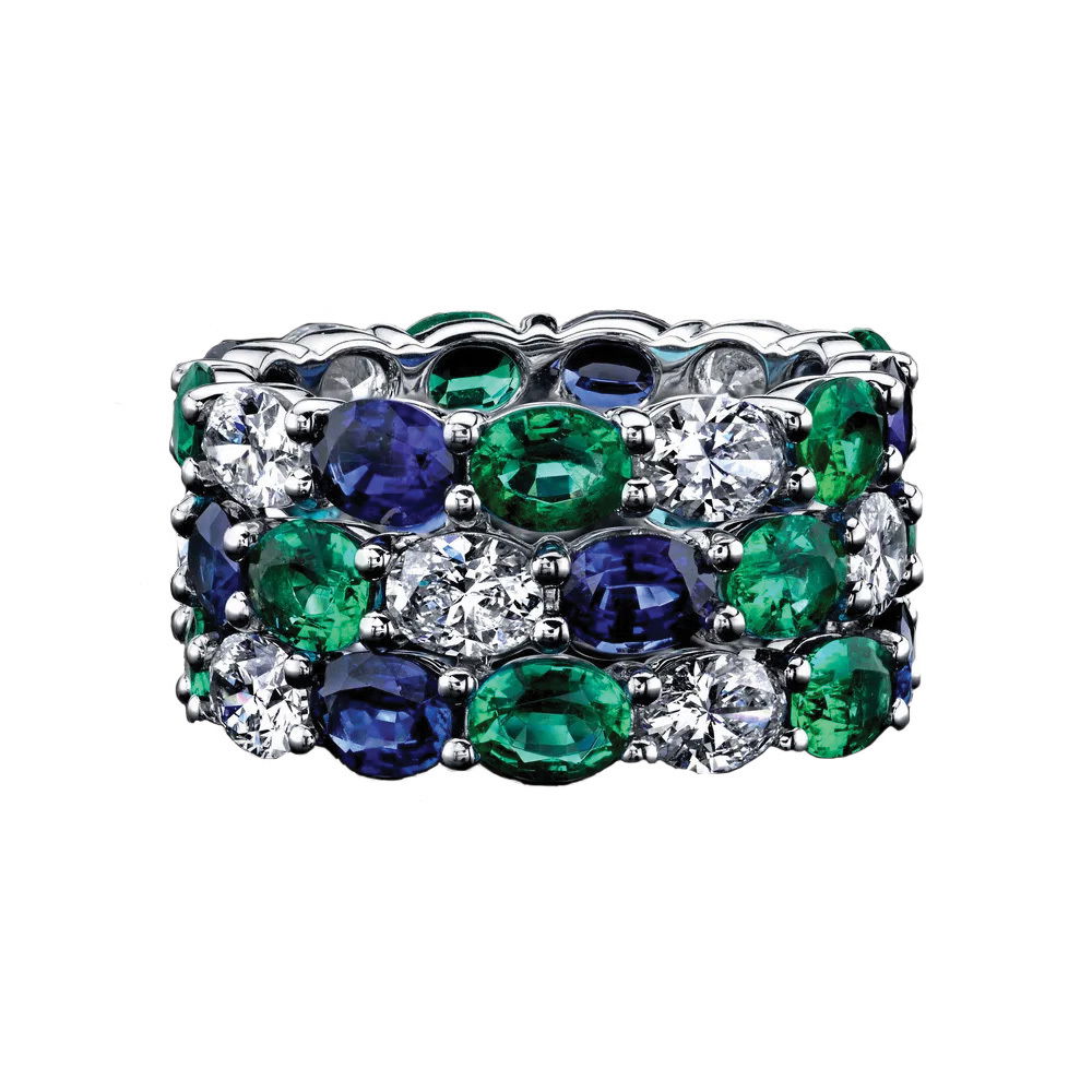 This platinum ring brings together vivid blue sapphires, rich emeralds, and sparkling diamonds for a striking look. Bold yet elegant, it’s a piece that captures attention with its vibrant colors and timeless style.-Platinum-Blue Sapphires, 4.98cts-Emeralds, 4.26cts-Diamonds, 3.69cts-Size 8Item# 001-200-01207 Glamour Ring