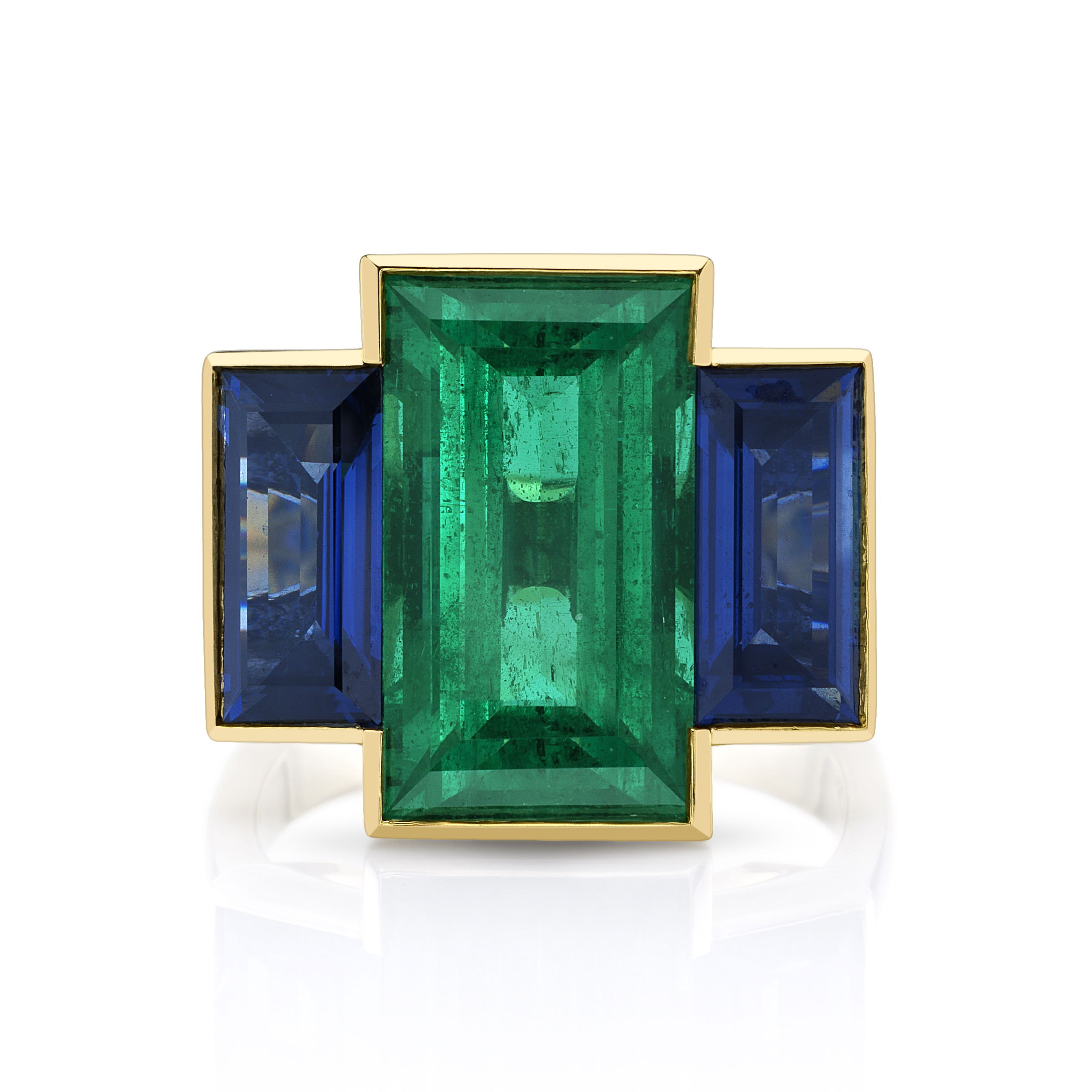 The Trilogy Ring showcases a rare, untreated emerald, paired with two vibrant sapphires, all set in 18k yellow gold. This piece is specially crafted for those who have a deep appreciation for the extraordinary.-18k yellow gold-Emerald, 8.61cts Bellerophon Certified #B7636-2 Sapphires, 4.47ctsItem# 2002000008 Trilogy Ring