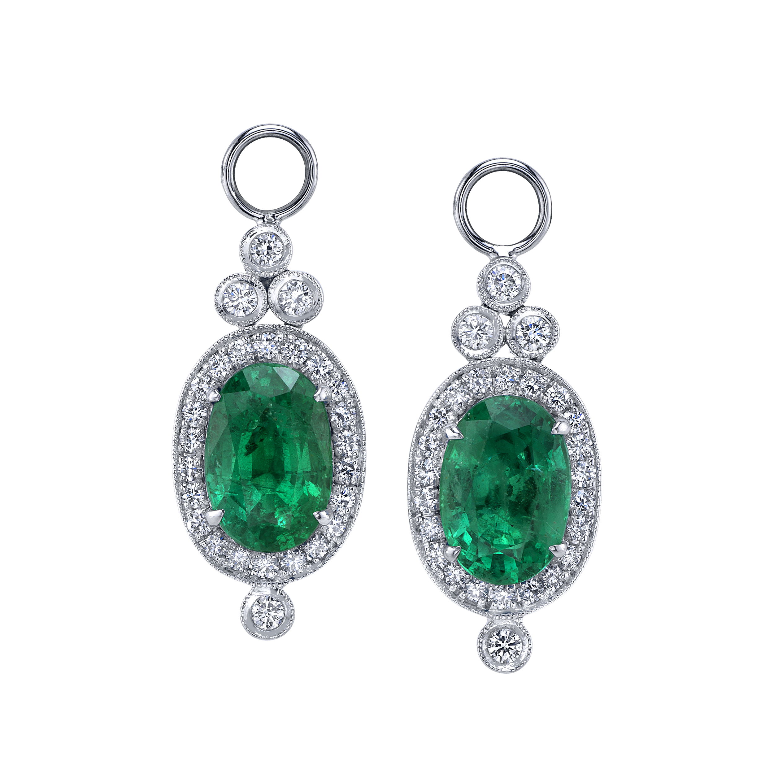 Crafted in white gold, these emerald earring charms bring a fresh burst of color with a classic twist. Accented with diamonds, they’re a striking way to switch up your look—day to night, bold to timeless. Huggies sold separately.-18k White gold-Diamonds, 0.60cts-Emeralds, 5.52ctsItem# 001-210-01598 Oval Emerald Earring Charms