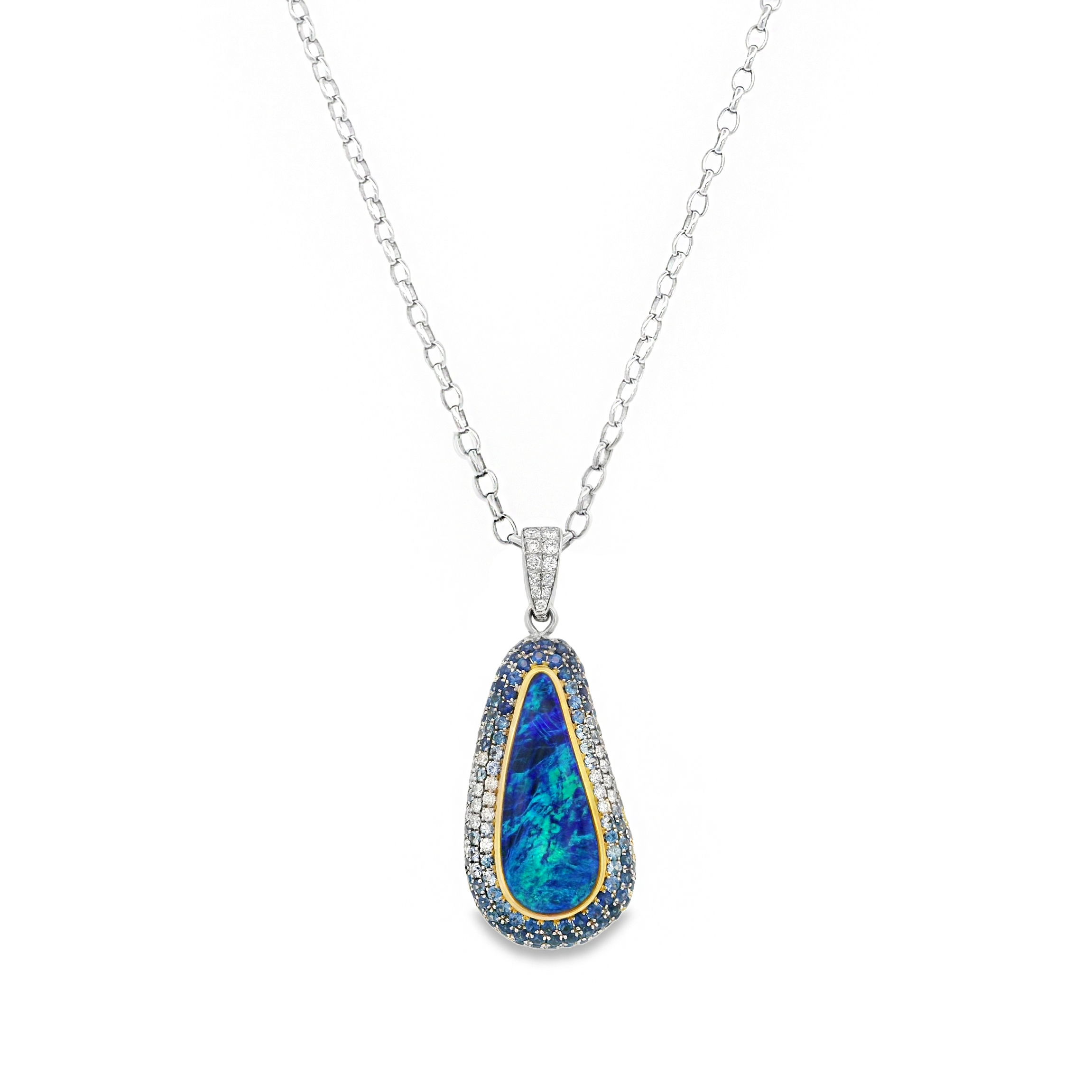 This beautiful two-toned opal pendant is a true statement piece. For those who love bold designs and vibrant color, this pendant is the perfect addition to your collection!-Round diamonds, 0.35cts-14k white gold 1.5mm cable chain-Length 18"Item# 235-00914 Opaline Pendant