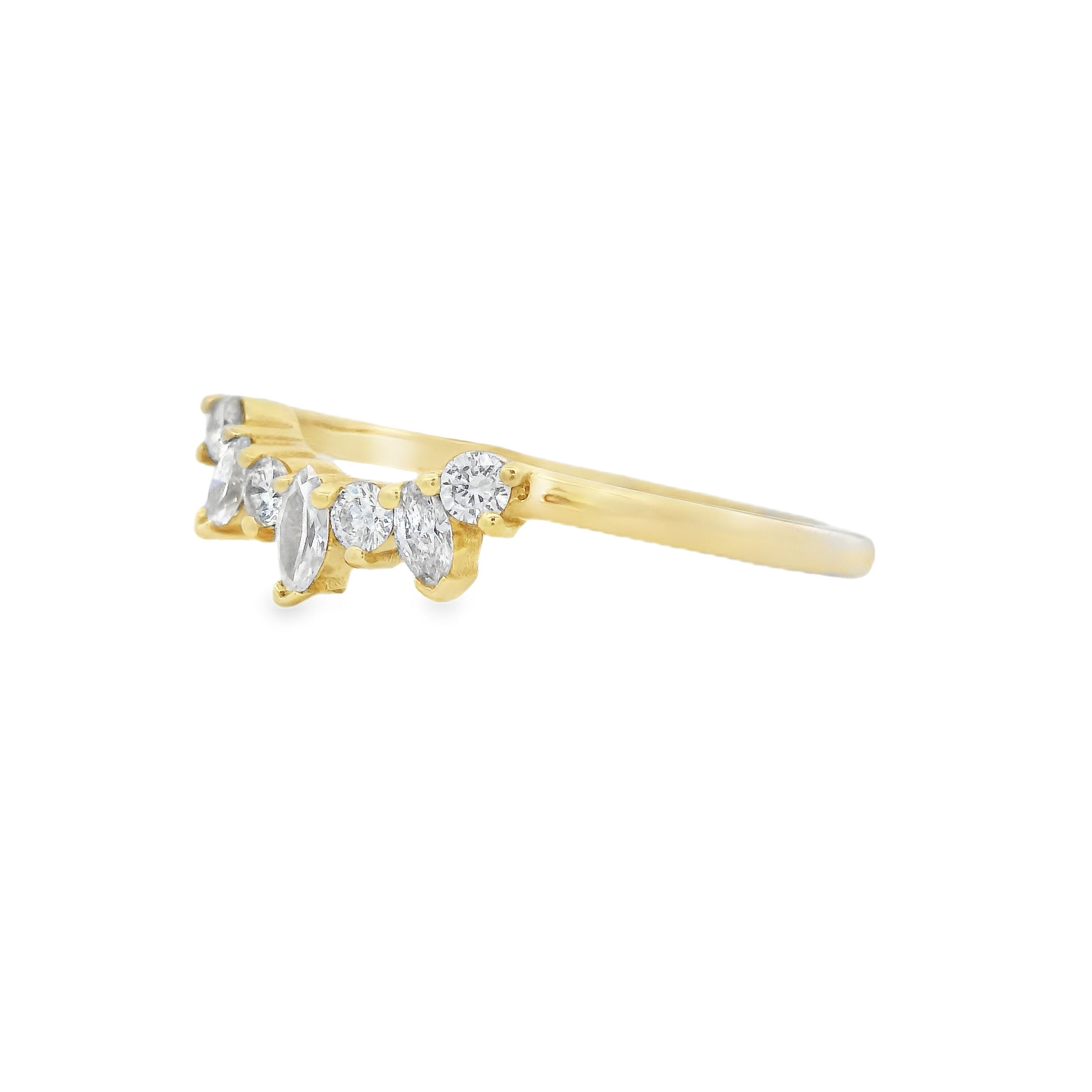This elegant 18k yellow gold contour wedding band features a stunning design of alternating round and marquise diamonds, creating a unique, sparkling effect. The curved shape is perfect for pairing with your engagement ring, offering a seamless and sophisticated fit. A beautiful choice to complement your love story.-18k Yellow gold-Round, Marquise diamonds, 0.21cts-Size 6.5, Contact for sizing optionsItem# 110-00570 Contour Wedding Band