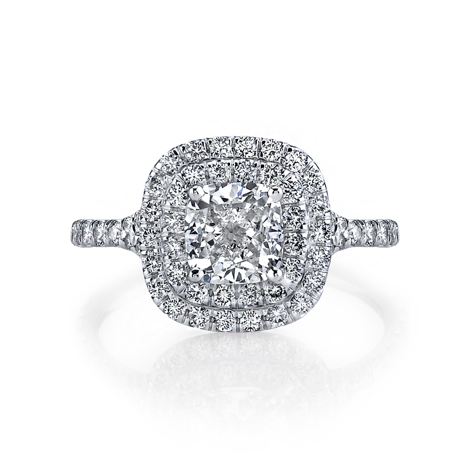 This exquisite platinum engagement ring showcases a stunning cushion diamond surrounded by a double halo of brilliant diamonds. The combination of classic design and modern elegance makes this ring a perfect symbol of lasting love and commitment.-Platinum-Cushion diamond, 1.04cts-Round diamonds, 0.53cts-Size 6, Contact for sizing optionsItem# 100-00160 Double Halo Engagement Ring