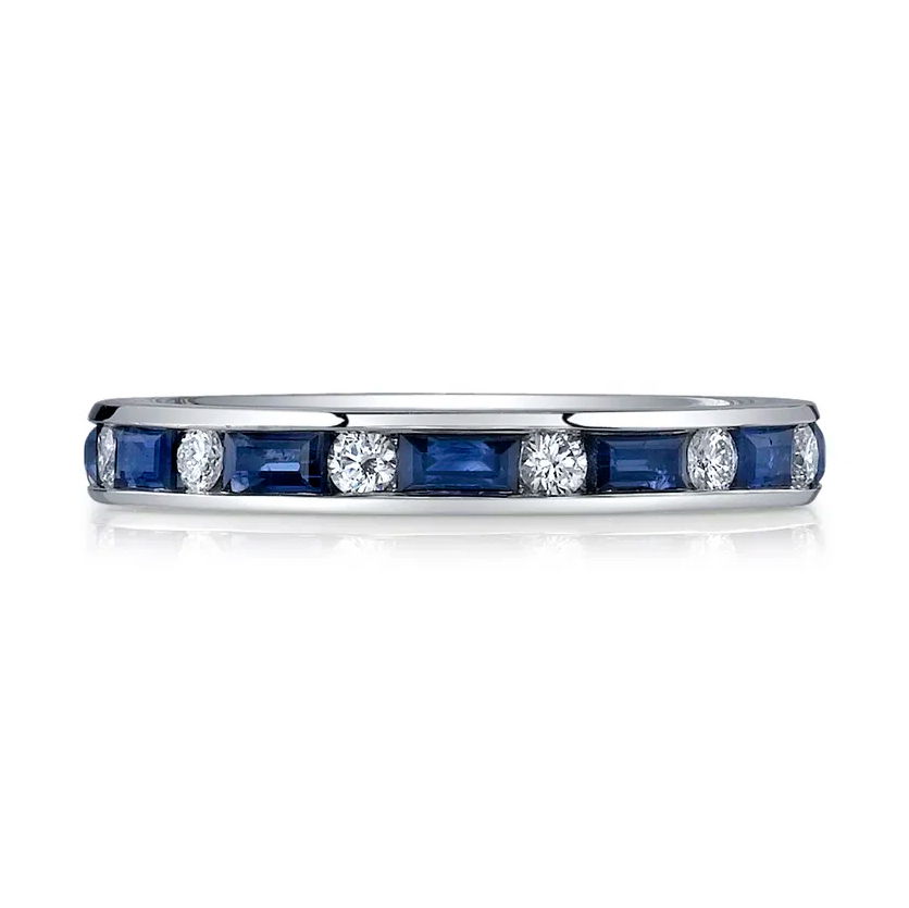 This 18k white gold eternity band features a stunning alternation of diamonds and blue sapphire baguettes, creating a striking and vibrant contrast. A perfect blend of elegance and color, this timeless piece is an exceptional symbol of lasting love.-18k White gold-Round diamonds, 0.39cts-Baguette blue sapphires, 1.30cts-Size 6, Contact for sizing optionsItem# 110-00648 Diamond & Sapphire Eternity Band