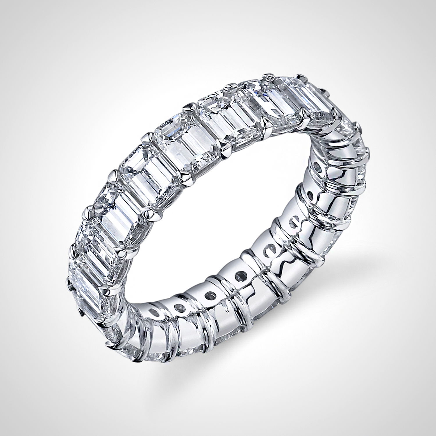 This white gold eternity band features 5.88cts of exquisite emerald cut diamonds, offering a sleek and sophisticated design with exceptional brilliance. A timeless symbol of enduring love, this elegant piece is a perfect gift for your next anniversary.-18k White gold-Emerald cut Diamonds, 5.88cts-Size 6, Contact for sizing optionsItems #: 120-00172 Emerald Cut Eternity Band