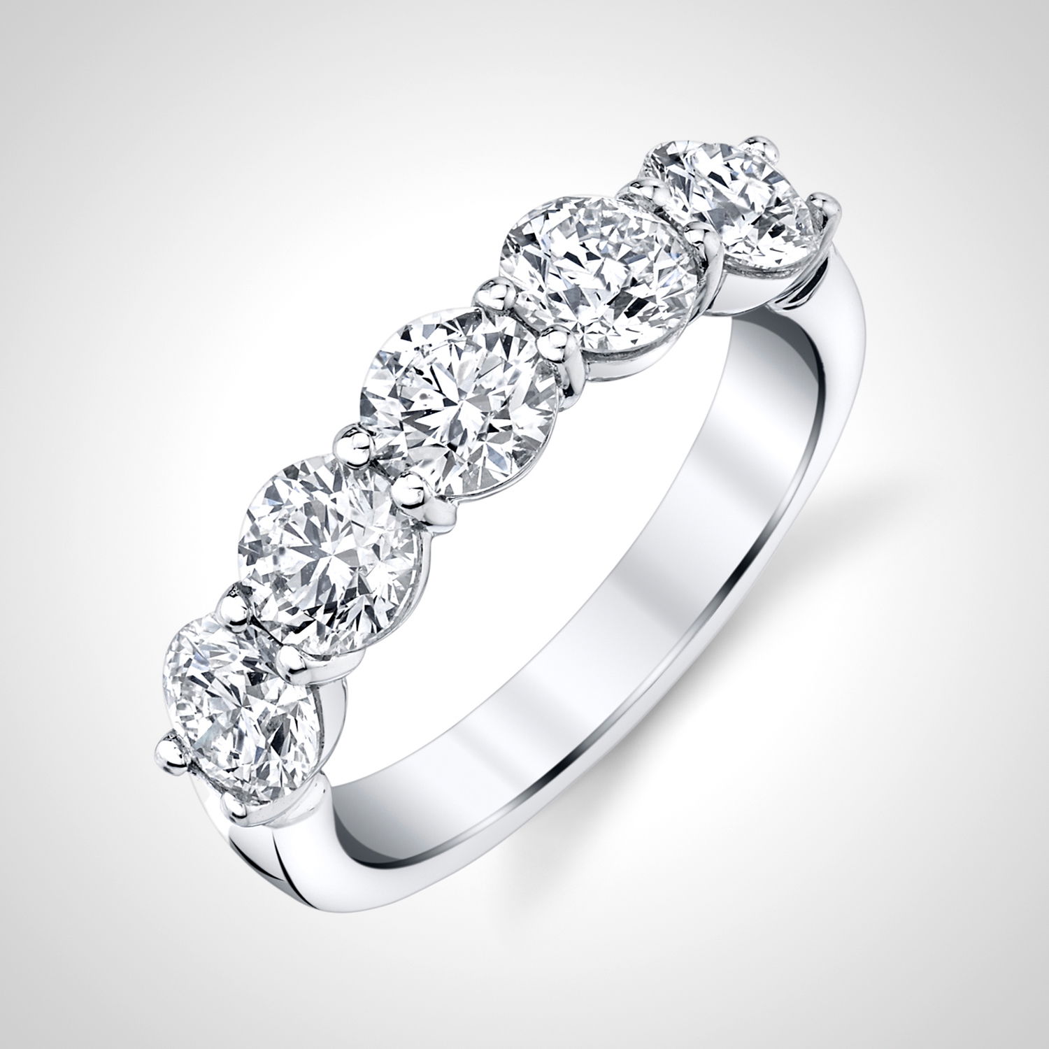 This white gold anniversary band features round diamonds set in a unique "buttercup" setting, enhancing their brilliance with a timeless and elegant design. A perfect way to celebrate your love, this band adds a sophisticated touch to any engagement ring.-18k White gold-Round Diamonds, 1.87cts-Size 6, Contact for sizing optionsItem #: 120-00181 Buttercup Anniversary Band