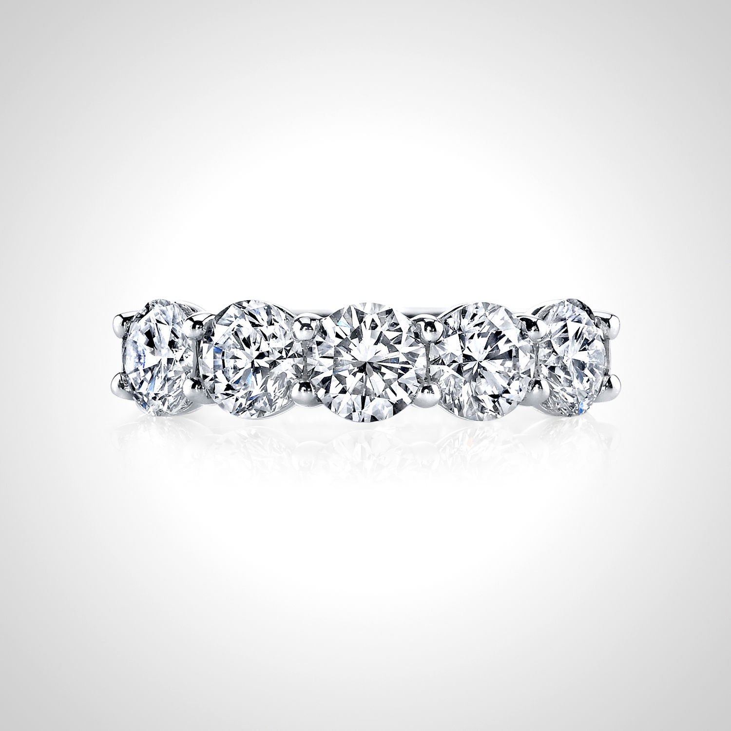 This 18k white gold anniversary band features round diamonds set in a unique "buttercup" setting, enhancing their brilliance with a timeless and elegant design. A perfect way to celebrate your love, this band adds a sophisticated touch to any engagement ring.18k White gold-Round diamonds, 1.87cts-Size 6, Contact for sizing optionsItem# 120-00181 Buttercup Anniversary Band