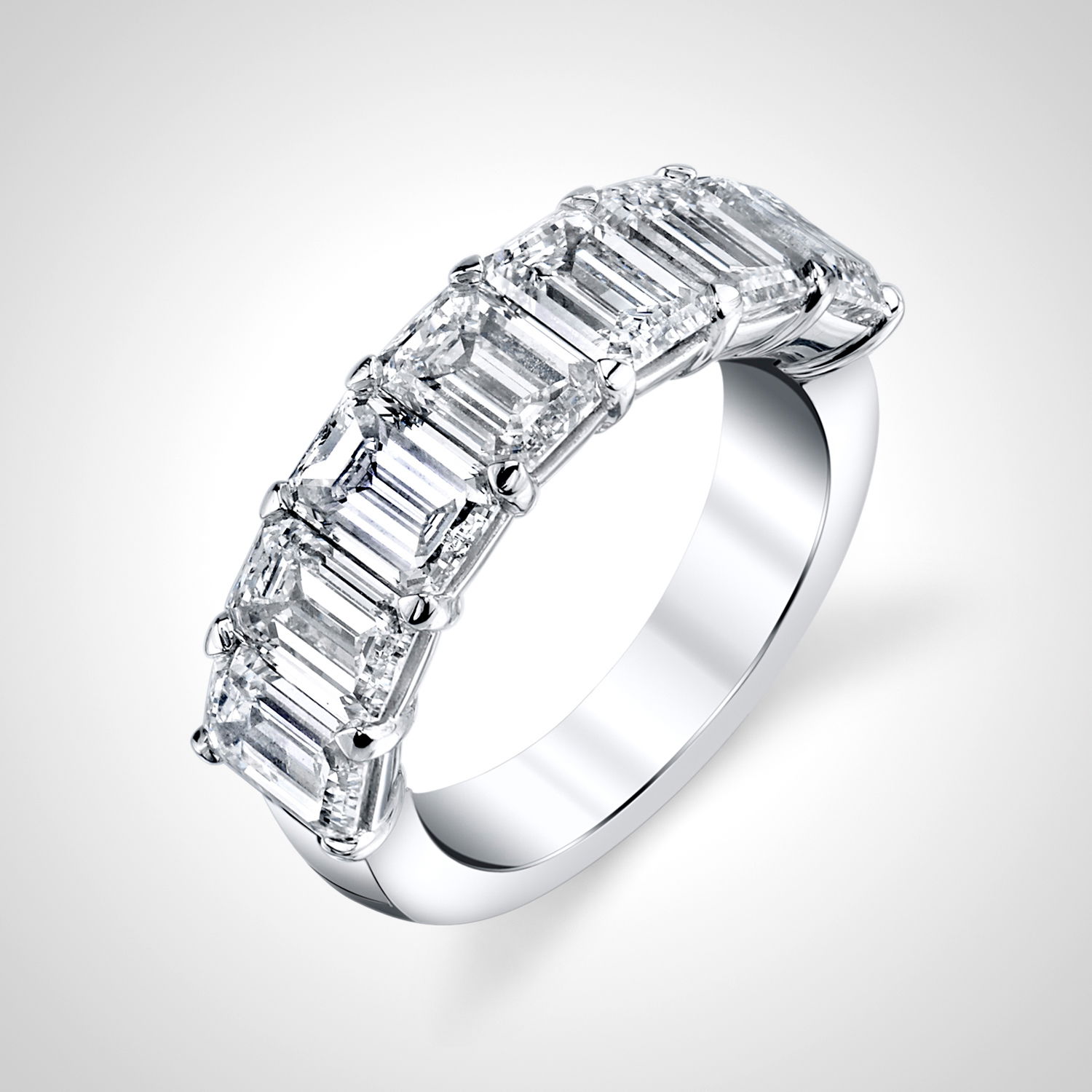 This anniversary band features stunning emerald cut diamonds set in a charming "buttercup" setting. The elegant design enhances the diamonds’ brilliance, making it an unbeatable gift for your next anniversary.-18k White gold-Emerald cut Diamonds, 2.76cts-Size 6, Contact for sizing optionsItem #: 120-00182 Emerald Cut Anniversary Band