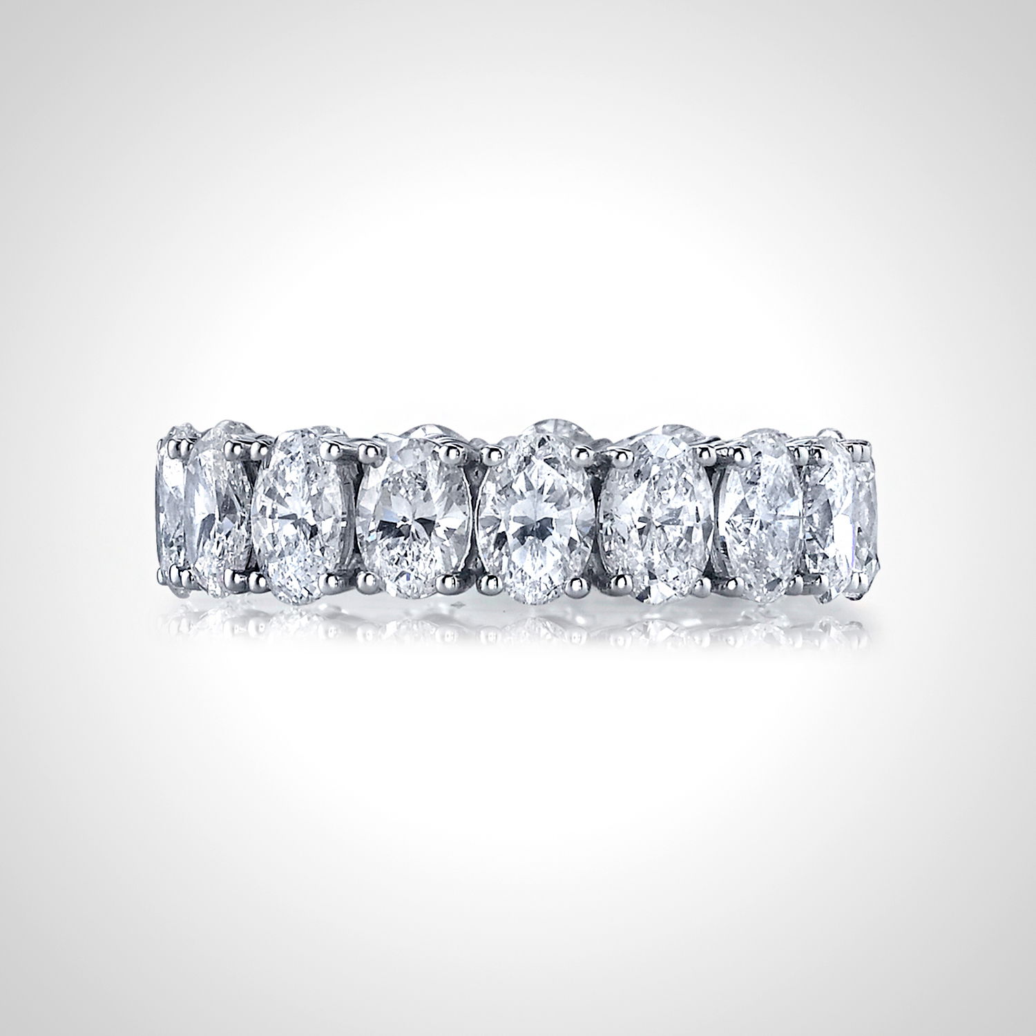 A timeless symbol of elegance, this eternity band is adorned with oval diamonds set in a delicate "buttercup" setting to enhance their brilliance. Designed for maximum sparkle and sophistication, it's perfect for marking life’s most cherished moments.-Platinum-Oval white diamonds, 5.80cts-Size, 6; contact for sizing optionsItem# 130-00020 Oval Eternity Band