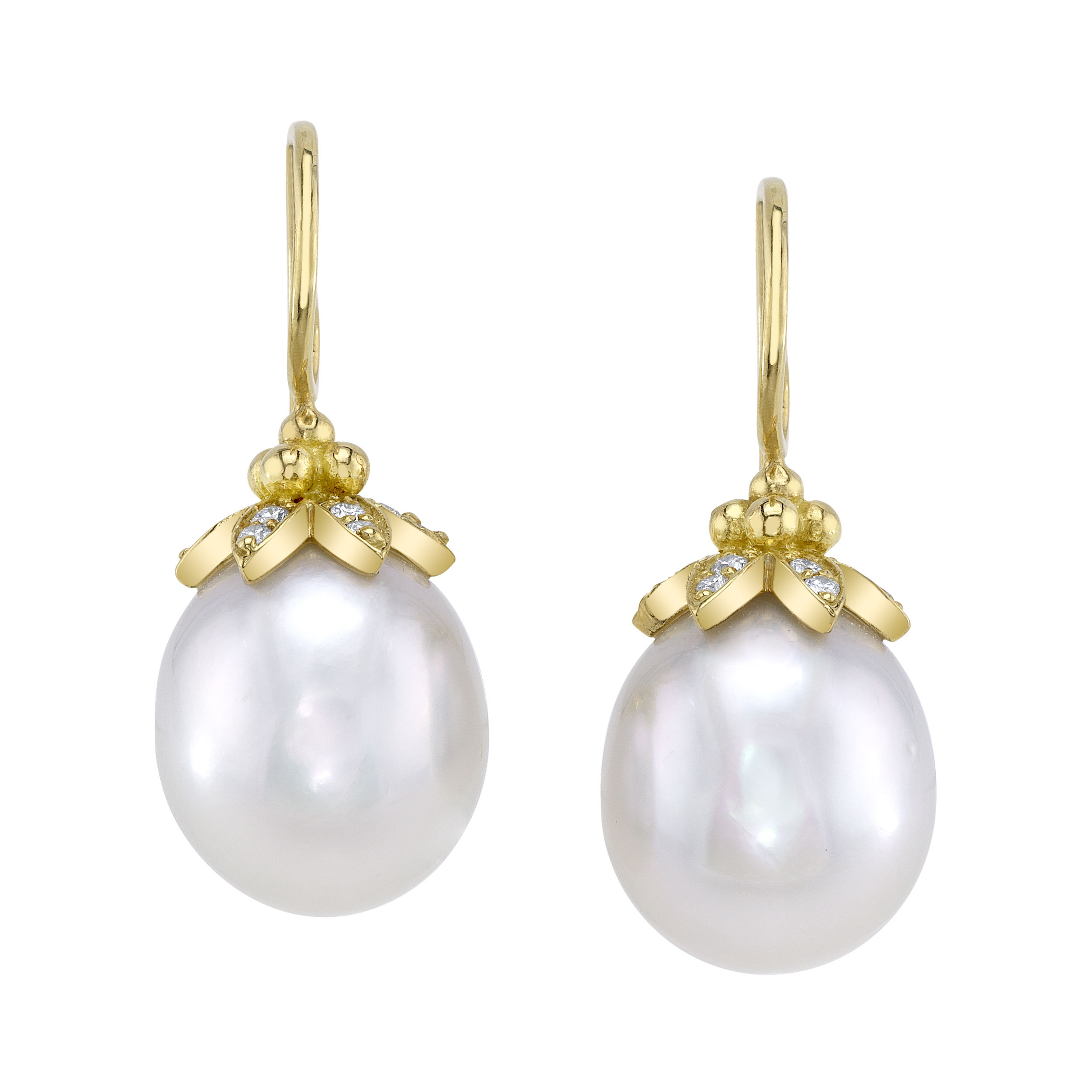 These earrings showcase lustrous white South Sea pearls set in 18k yellow gold, accented with sparkling round diamonds. The combination of radiant pearls and brilliant diamonds creates a timeless, elegant pair perfect for any special occasion.-18k Yellow gold-White Sea pearls-Round diamonds, 0.22ctsItem# 310-00288 Estelle Earrings