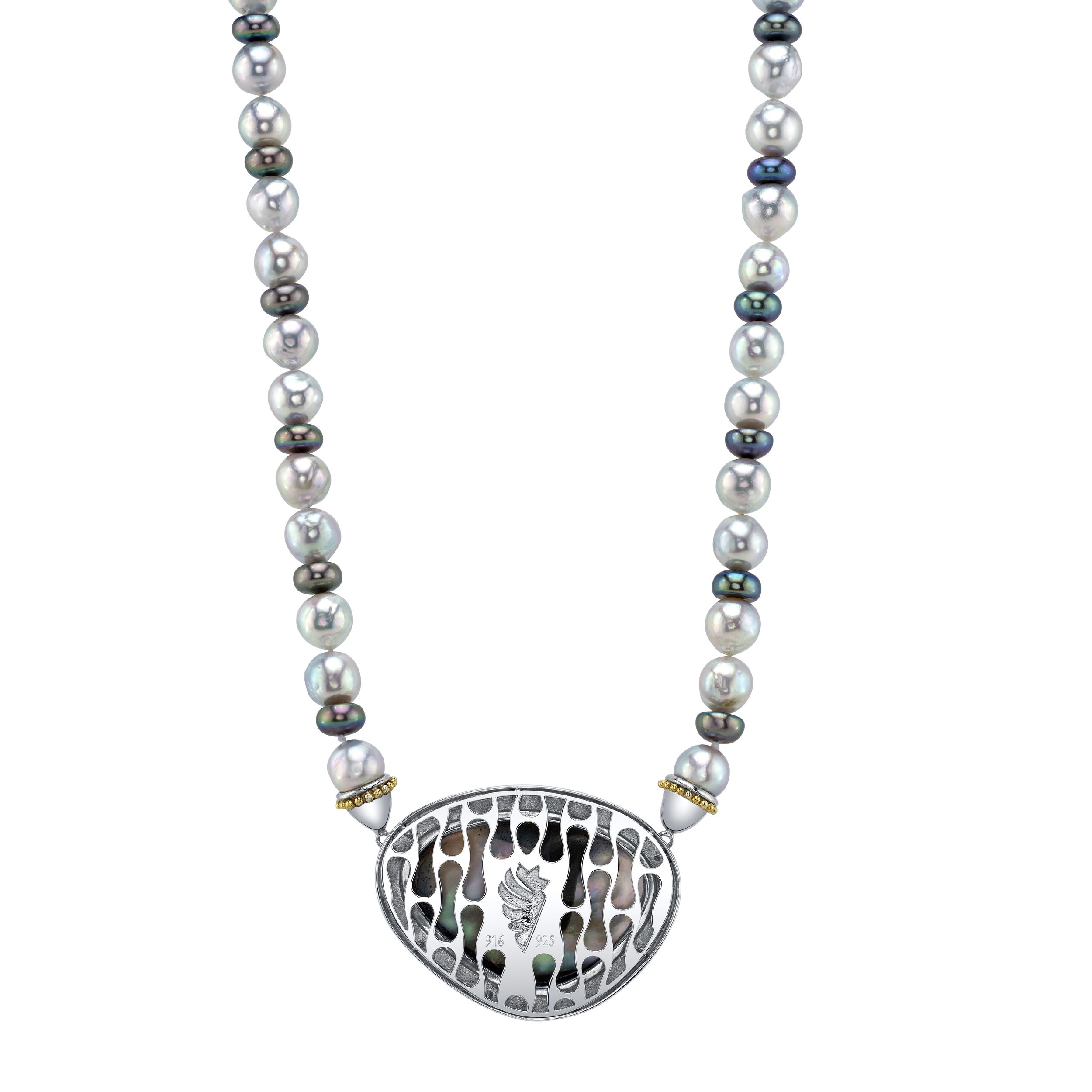 This striking necklace combines 22k yellow gold and sterling silver, showcasing a stunning array of pearls with a large blister pearl at its center. The bold mix of metals and the unique centerpiece create a truly captivating piece that balances elegance and artistry.-22k Yellow gold-Sterling silver-Large blister pearl-Akoya blue and black pearlsItem# 325-00211 Margaret Necklace
