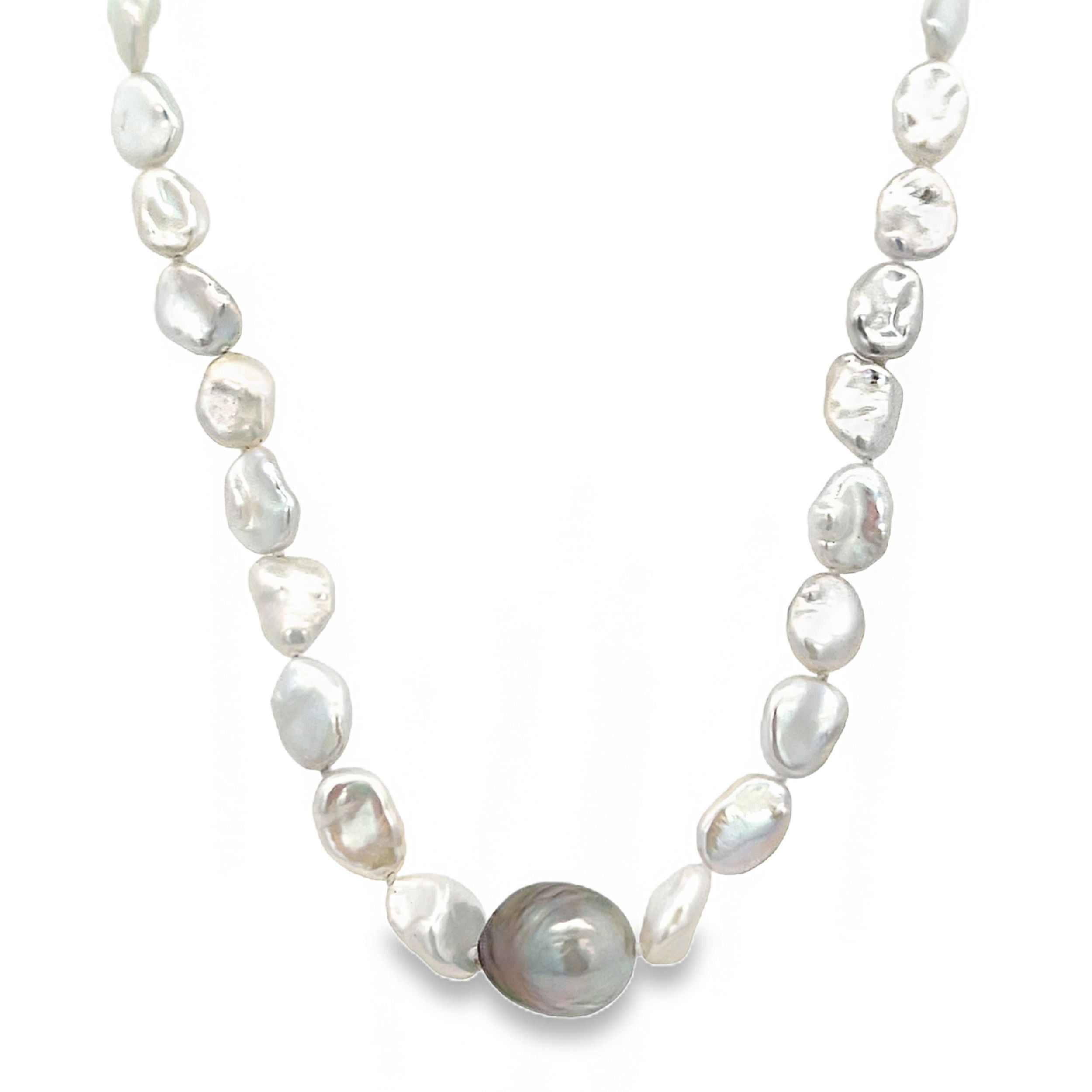 This necklace features sterling silver with a beautiful mix of Tahitian and white pearls. The contrast of dark and light pearls creates a versatile piece that complements any style.-Sterling silver-Tahitian and white pearls-Length 17”Item# 325-00230 Darling Necklace