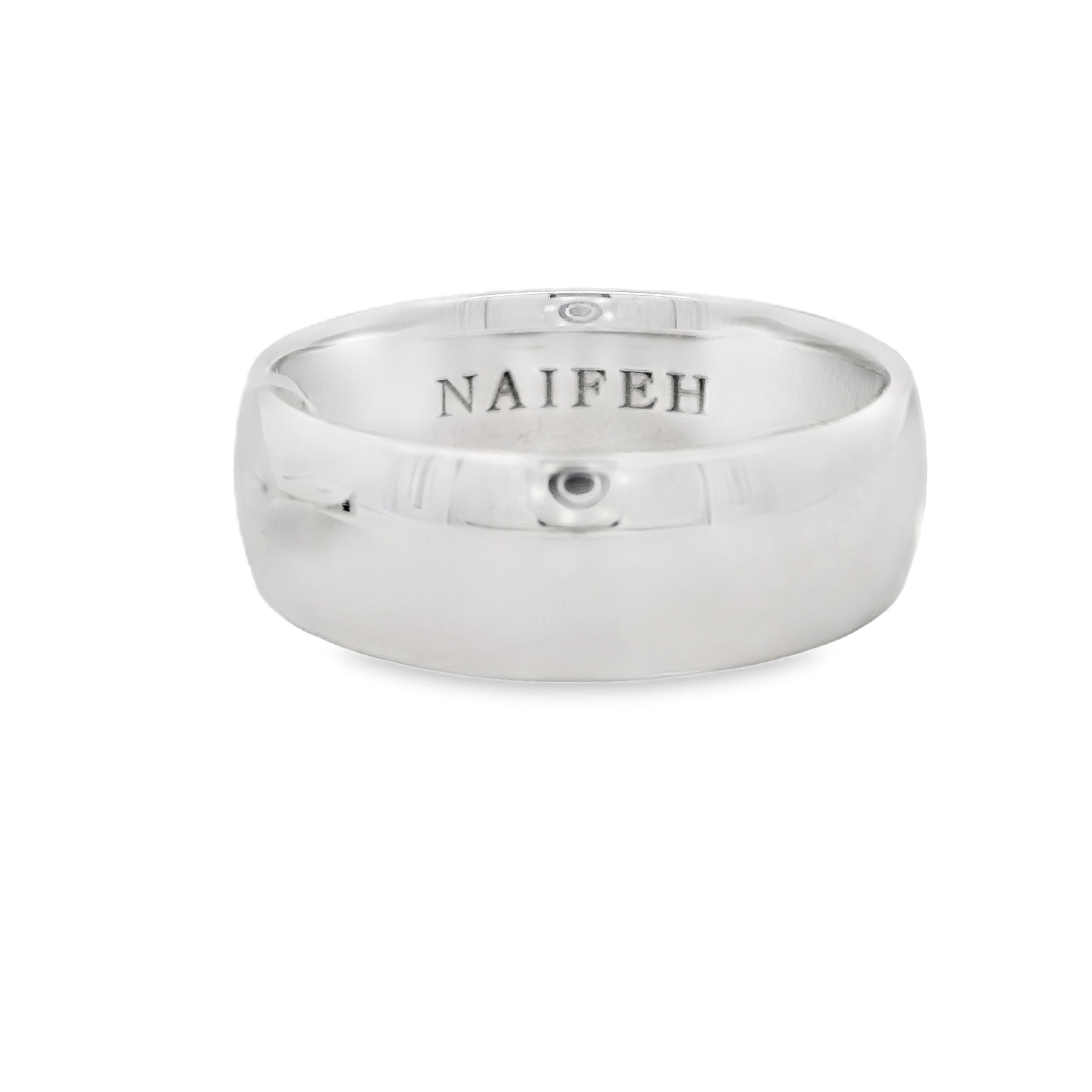 Crafted in high polished 18K white gold, this domed men's wedding band offers timeless style with a refined, polished finish. Its classic silhouette and substantial weight make it a symbol of enduring strength and commitment.-18k White gold-7mm-Size 10, Contact for sizing optionsItem# 405-00086 Domed 7mm Men's Band