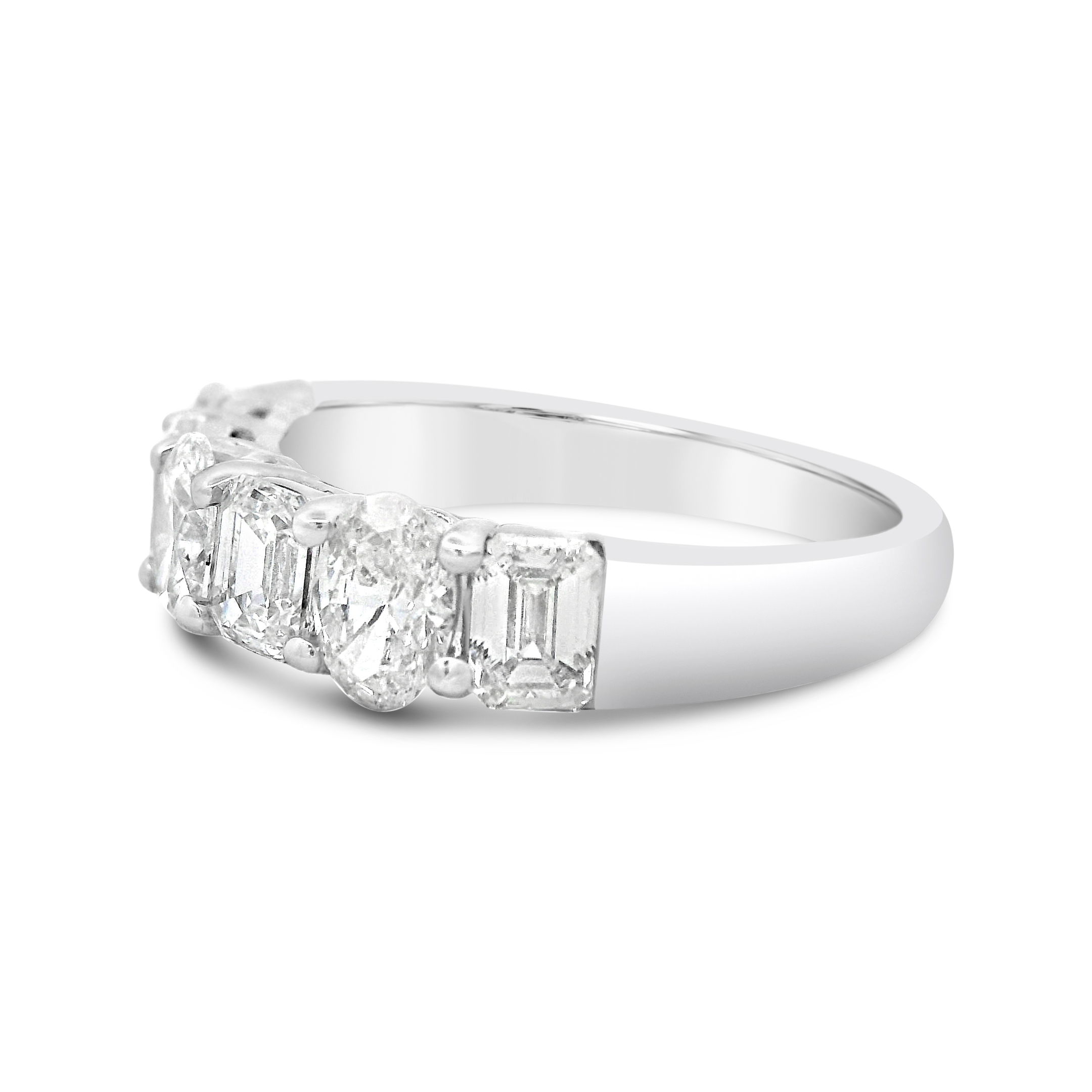 Celebrate your love with this timeless anniversary band, featuring a stunning alternating pattern of oval and emerald cut diamonds set in 18k White gold. The combination of brilliant ovals and sleek emerald cuts creates a captivating contrast, offering both sparkle and sophistication. -18k White gold-Emerald cut diamonds, 1.25cts-Oval Diamonds, 0.92cts-Size 6.25, Contact for sizing optionsItem# 130-01154 Oval & Baguette Anniversary Ring