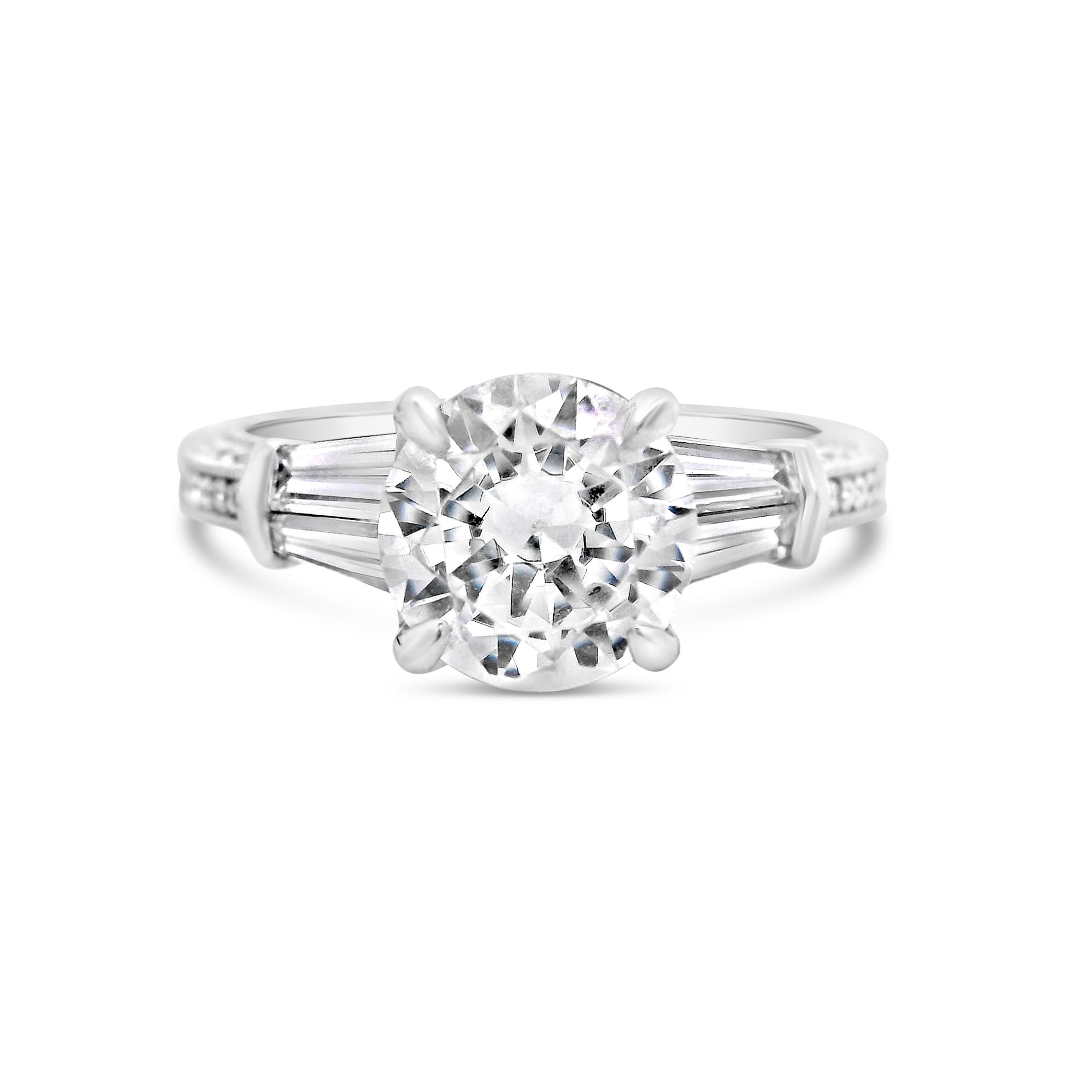 Designed for timeless elegance, this 18k White gold semi-mount features tapered baguette diamonds that gracefully flank the center stone of your choice. The sleek baguettes add a refined touch, enhancing the brilliance of the centerpiece while creating a sophisticated, balanced look. (Center stone not included)-18k White gold-Baguette diamonds, 0.57cts-Round diamonds, 0.30cts-Size 6.5, Contact for sizing optionsItem# 140-00003 Round & Baguette Semi-Mount