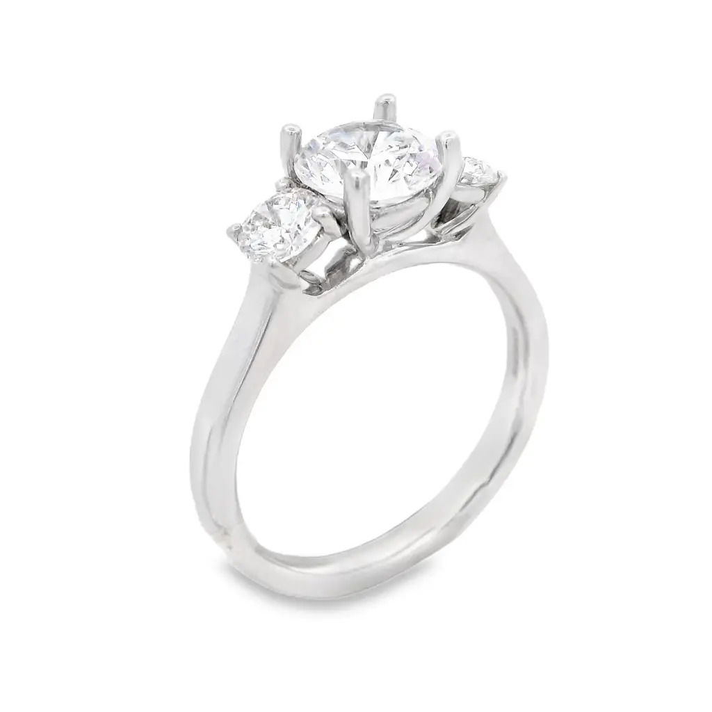 This three-stone semi-mount is a timeless setting with symbolic beauty. Elegant and refined, this setting enhances brilliance while providing a secure and sophisticated foundation for your perfect diamond or gemstone. Includes two round diamonds with a total weight of 0.50cts. (Center stone not included)-18k White gold-Round diamonds, 0.50cts-Size 6, Contact for sizing optionsItem# 140-00159 Round Three-Stone