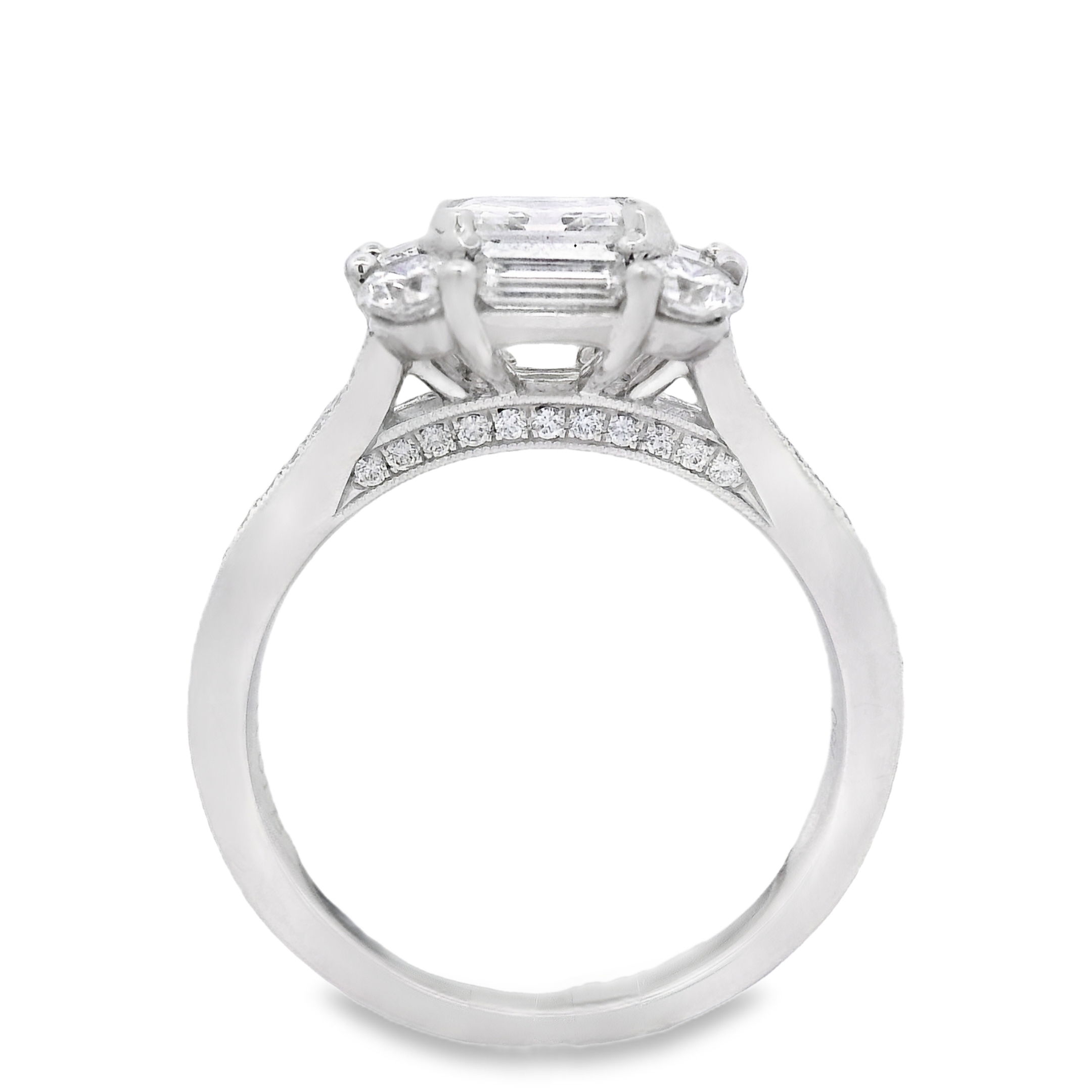 This halo and split shank semi mount combines classic elegance with modern design. The diamond halo encircles your center stone, adding a brilliant sparkle, while the split shank enhances the overall structure and adds a touch of sophistication. Center diamond sold separately-18k White gold-Asscher diamond, 1.04cts (sold separately)-Baguette diamonds, 0.53cts-Round diamonds, 0.68cts-Size 6.5, Contact for sizing optionsItem# 140-00176 Multi-Stone Engagement Ring
