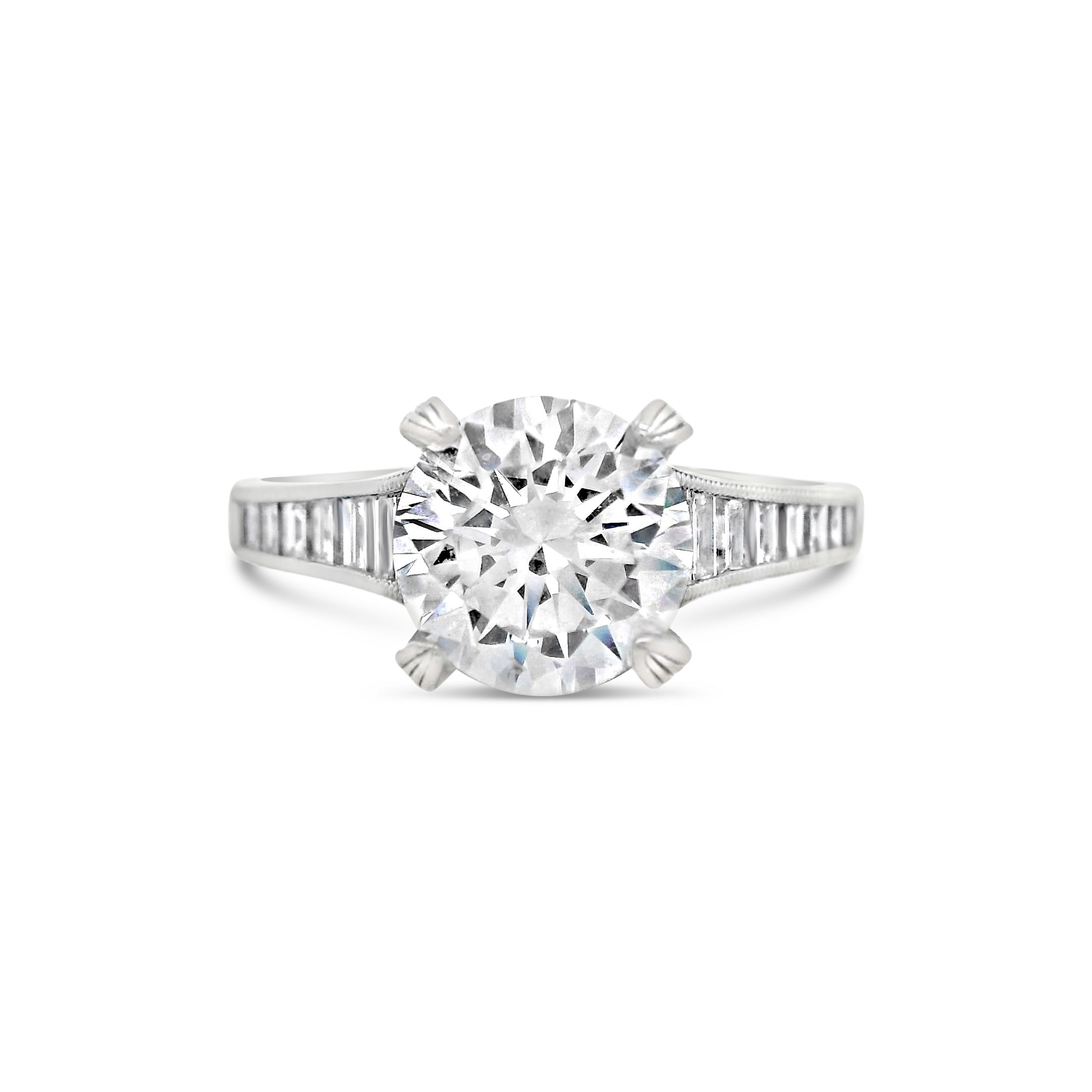 Elegant with a contemporary edge, this 18k white gold semi-mount features channel-set baguette diamonds, offering a sleek and sophisticated design. The clean lines of the baguettes enhance the brilliance of your chosen center stone while providing a refined, modern touch. (Center stone not included)-18kt White gold-Baguette diamonds, 0.62cts-Round diamonds, 0.13cts-Size 6.5, Contact for sizing optionsItem# 140-00192 Round & Baguette Semi-Mount
