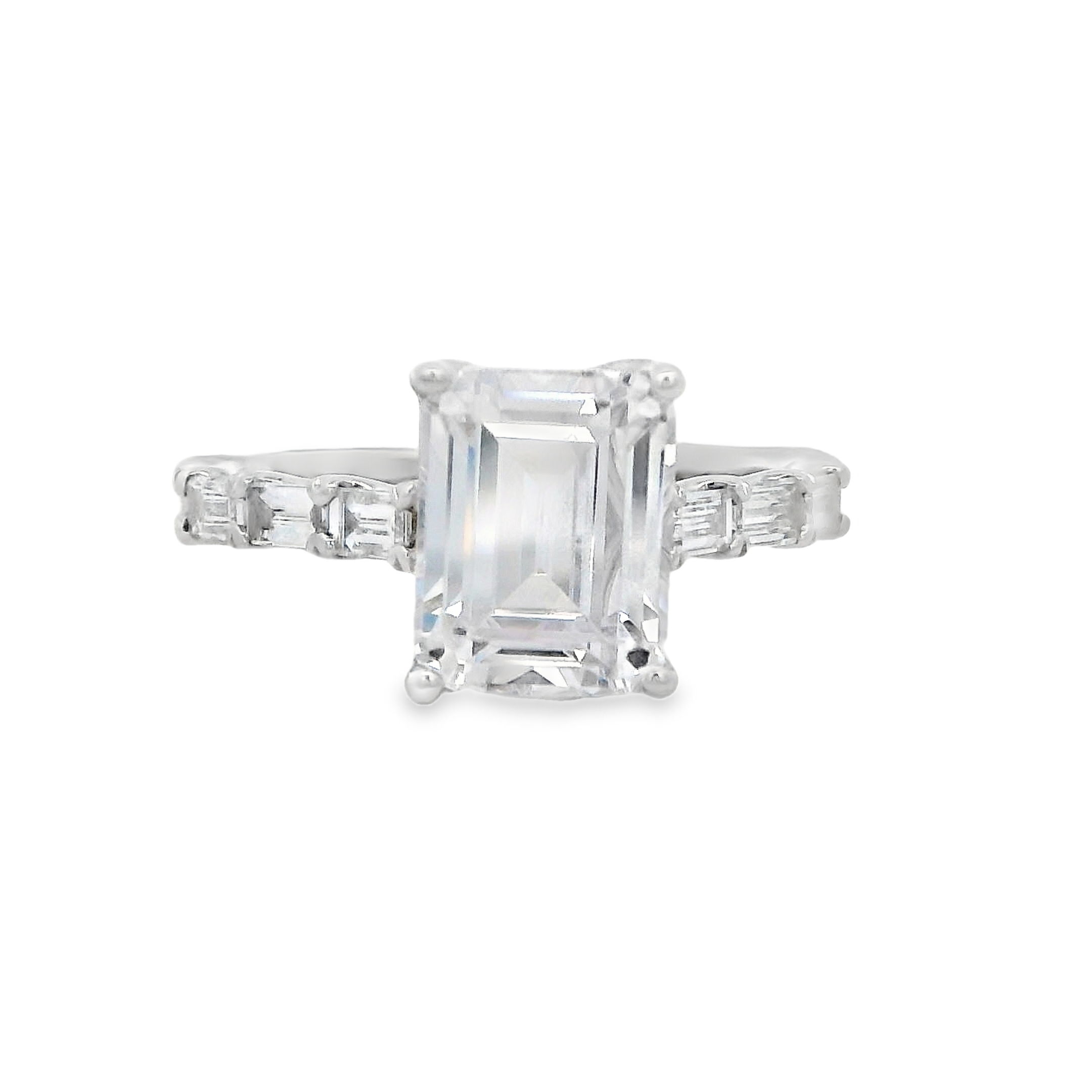 This sophisticated 14k White gold semi-mount features bar-set emerald cut diamonds along the shank, creating a sleek and modern look. The clean lines and timeless elegance of the design enhance the beauty of your chosen center stone, making it a perfect choice for those who appreciate refined luxury. (Center stone not included)-14k White gold-Emerald cut diamonds, 0.50cts-Size 6.5, Contact for sizing optionsItem# 140-00208 Emerald Cut Mounting