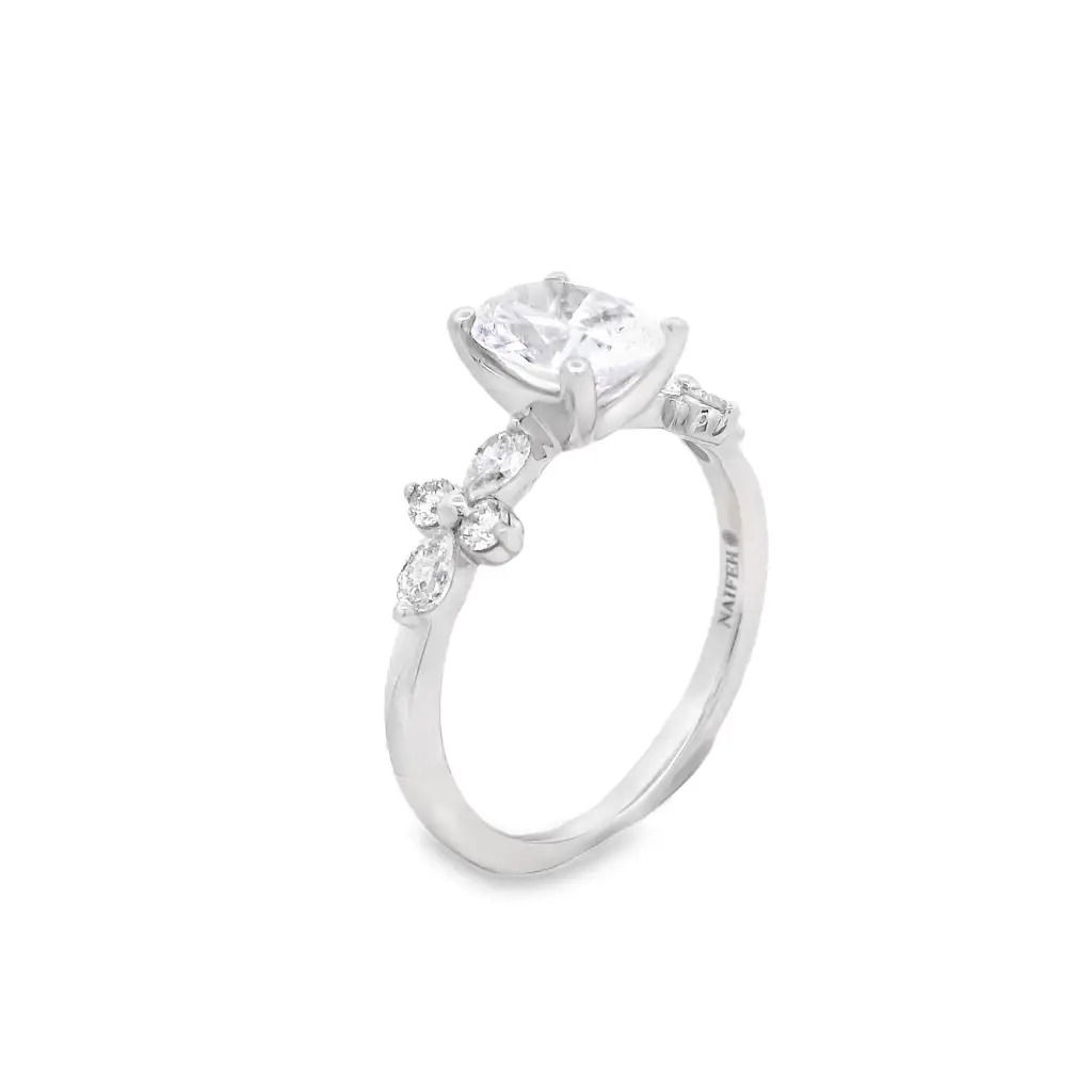 This stunning 18k White gold semi-mount features pear and round side diamonds arranged in a unique "cross" shape, adding a touch of elegance and symmetry to your chosen center stone. The distinctive design creates a balanced and sparkling look, perfect for a one-of-a-kind engagement ring that stands out with timeless beauty. (Center stone not included)-18k White gold-Round, Marquise diamonds, 0.50cts-Size 6.5, Contact for sizing optionsItem# 140-00222 Blossom