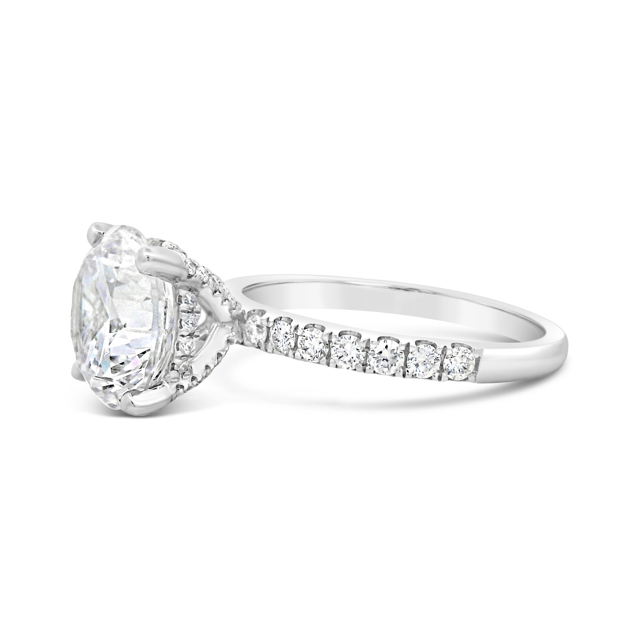 Timeless elegance meets brilliant sparkle. This 18k White gold semi-mount is designed to enhance your chosen center stone, the shimmering diamonds along the band add a touch of luxury and sophistication. A perfect setting for a ring that radiates beauty from every angle. (Center stone not included)-18k White gold-Round diamonds, 0.43cts-Size 6.5, Contact for sizing optionsItem# 140-00226 Round Diamond Solitaire Mounting