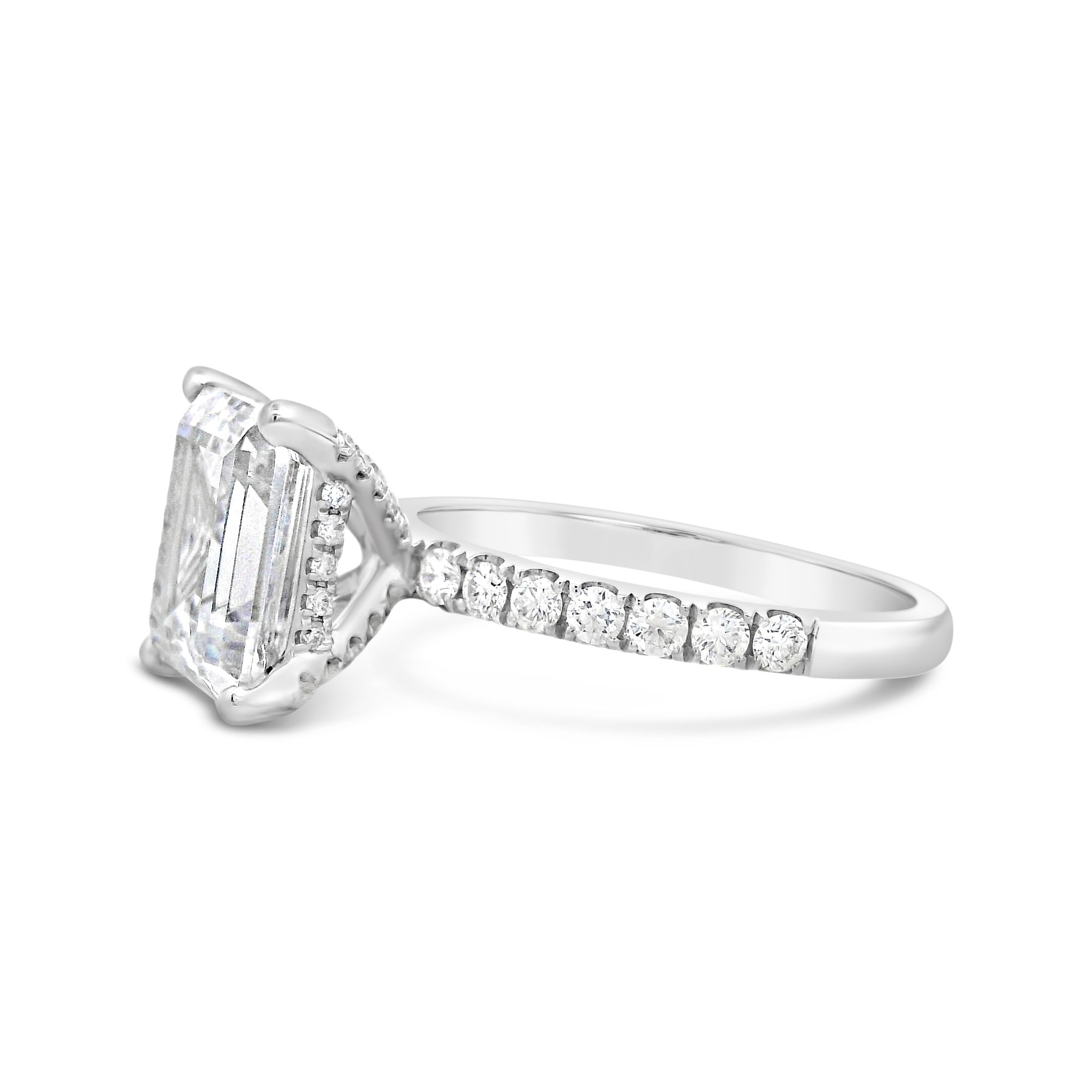 Timeless elegance meets brilliant sparkle. This 18k White gold semi-mount is designed to enhance your chosen center stone, the shimmering diamonds along the band add a touch of luxury and sophistication. A perfect setting for a ring that radiates beauty from every angle. (Center stone not included)-18k White gold-Round Diamond 0.42cts -Size 6.25, Contact for sizing optionsItem# 140-00227 Emerald Cut Semi-Mount